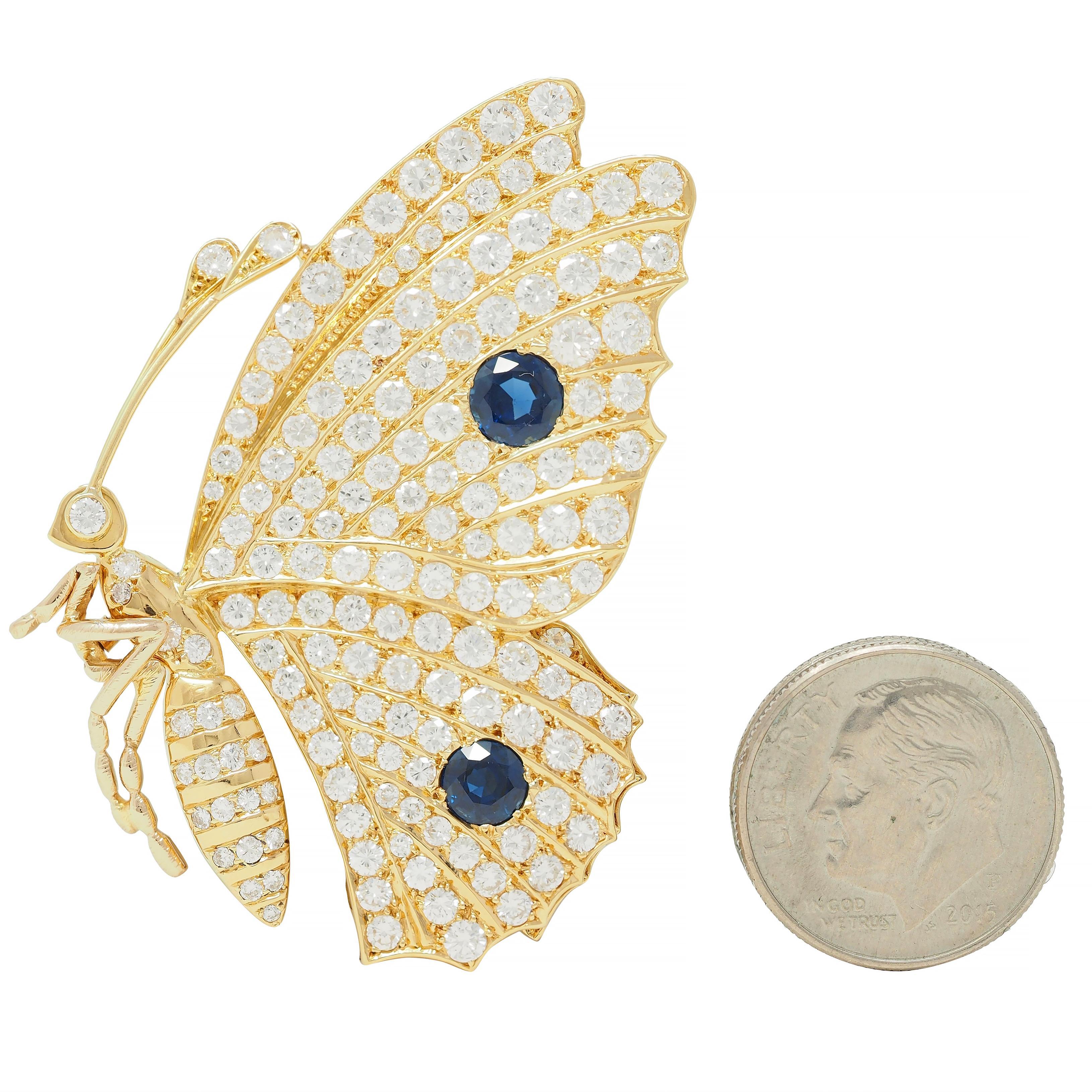 Designed as a stylized butterfly depicted in profile with folded wings
Pavé set throughout with transitional cut diamonds
Weighing approximately 5.10 carats total - G/H color with VS2 clarity
Accented by round cut sapphires bead set on