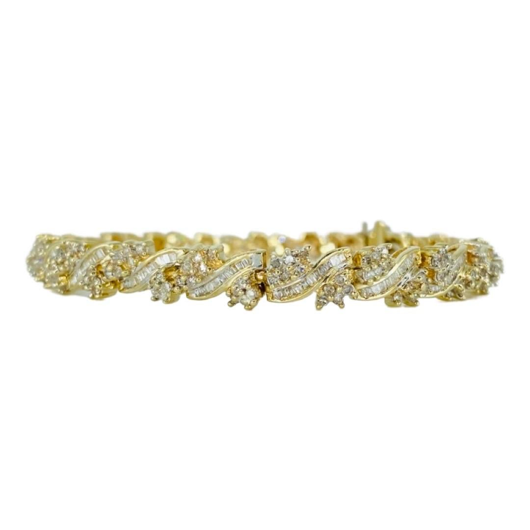 Vintage 6.50 Total Carat Weight Diamonds Floral Bracelet. The bracelet is 7.25 inches in length and measures 7mm in width. The diamonds featured in this bracelet are round and baguette cut diamonds for a total carat weight of 6.50 carat. The