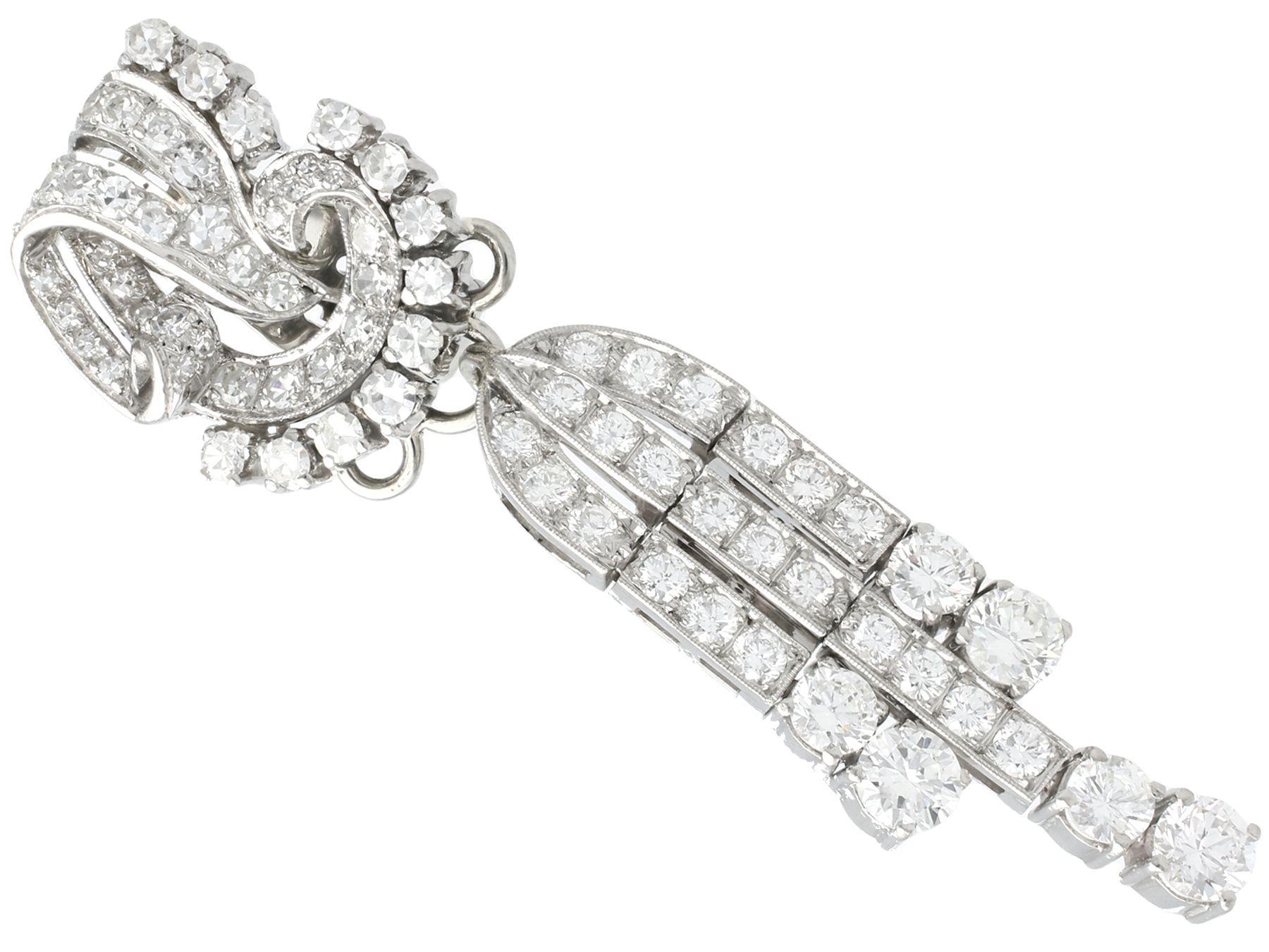 A stunning pair of vintage Art Deco 6.70 carat diamond and platinum day and night earrings; part of our diverse antique jewelry and estate jewelry collections.

These stunning, fine and impressive day and night earrings have been crafted in
