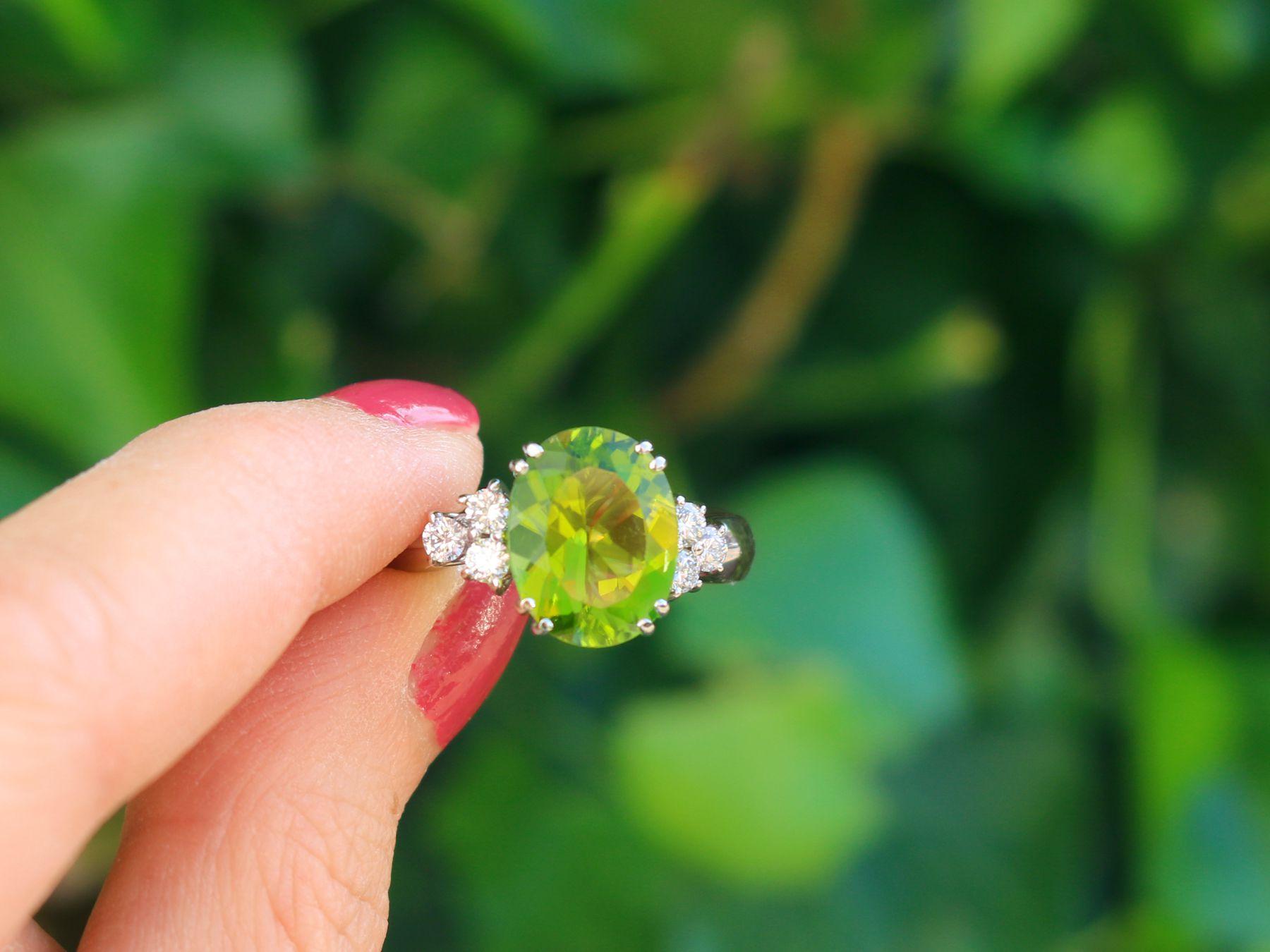 A stunning, fine and impressive vintage 6.84 Carat peridot and 0.48 Carat diamond, 18 karat white gold dress ring; part of our diverse gemstone jewelry and estate jewelry collections.

This stunning, fine and impressive vintage ring has been crafted
