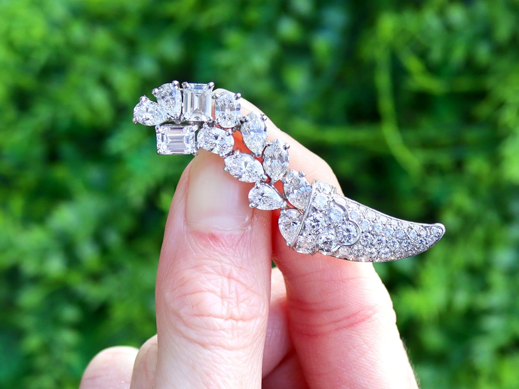 A stunning, fine and impressive vintage 1950s 6.87 carat diamond and platinum cornucopia brooch; part of our diverse diamond brooches collection.

This stunning, fine and impressive vintage diamond brooch has been crafted in 18k white gold and