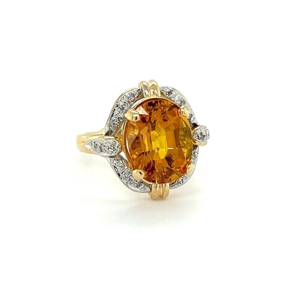 Simply Beautiful! Vivid Orange Yellow Natural Sapphire and Diamond Ring. Centering a securely nestled Hand set Oval Vivid Orange Yellow Sapphire, weighing 6.92 Carats. Amazing color! Carte Blu Lab report #46090101. Surrounded by Diamonds approx.