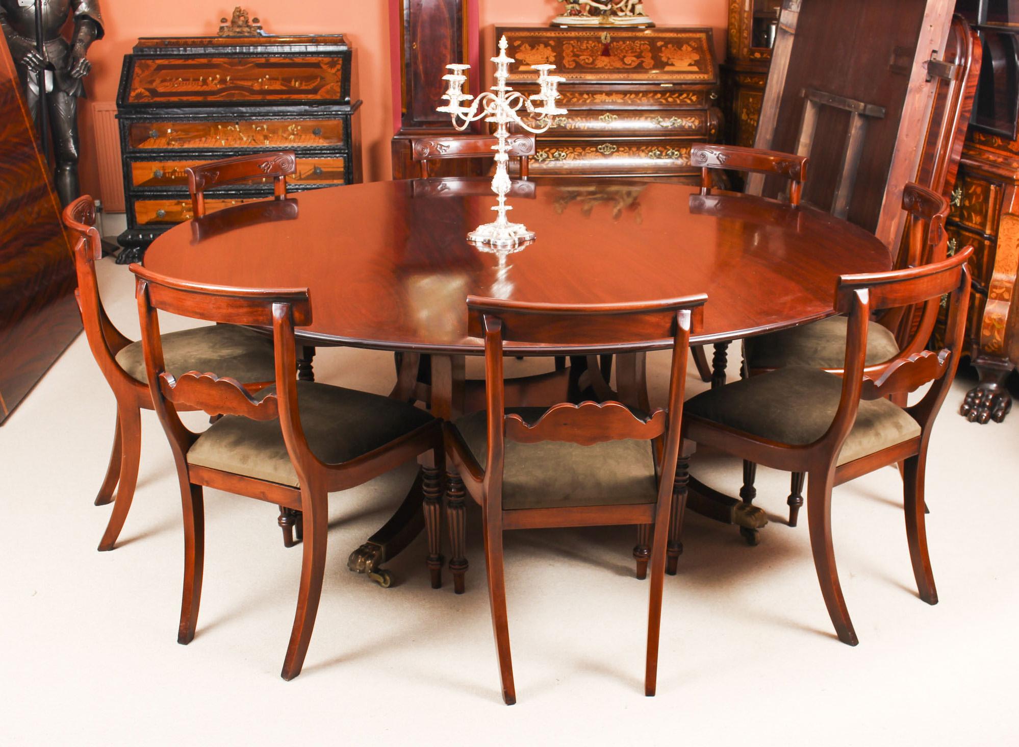 This is a beautiful dining set comprising a Regency Revival flame mahogany dining table made by the Master Cabinet maker William Tillman and bearing his label on the underside, circa 1970 in date with a set of eight vintage dining chairs.

The