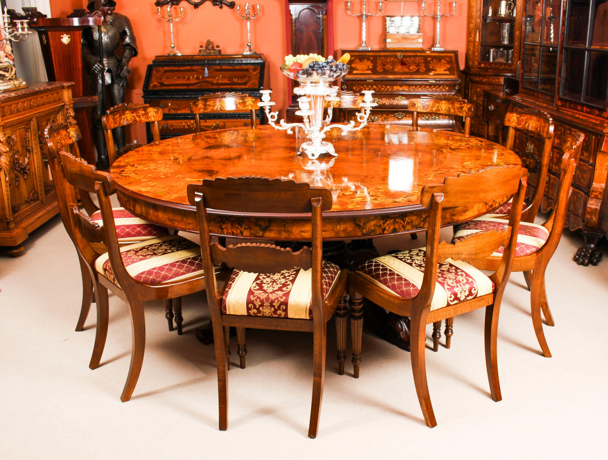 A beautiful large 200 cm diameter dining set comprising a superb vintage table that can seat ten in comfort and ten chairs, dating from the mid-20th century.

The table is of fabulous quality and in excellent condition. It is highly desirable to