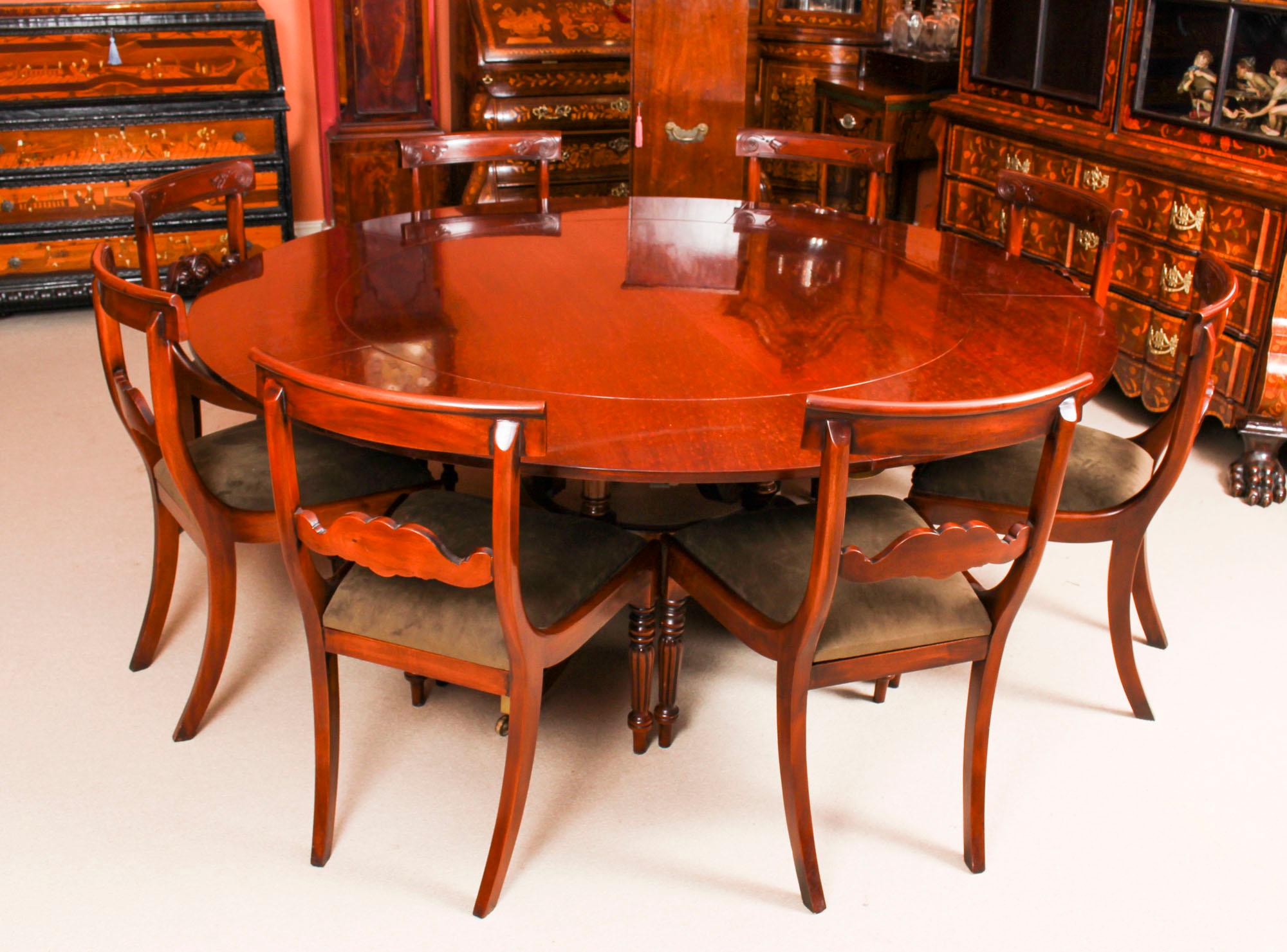 This beautiful dining set comprises a Regency Revival Jupe style dining table mid-20th century in date, with a matching set of eight bespoke Regency style dining chairs.

The table has a solid mahogany top with a reeded edge that has five