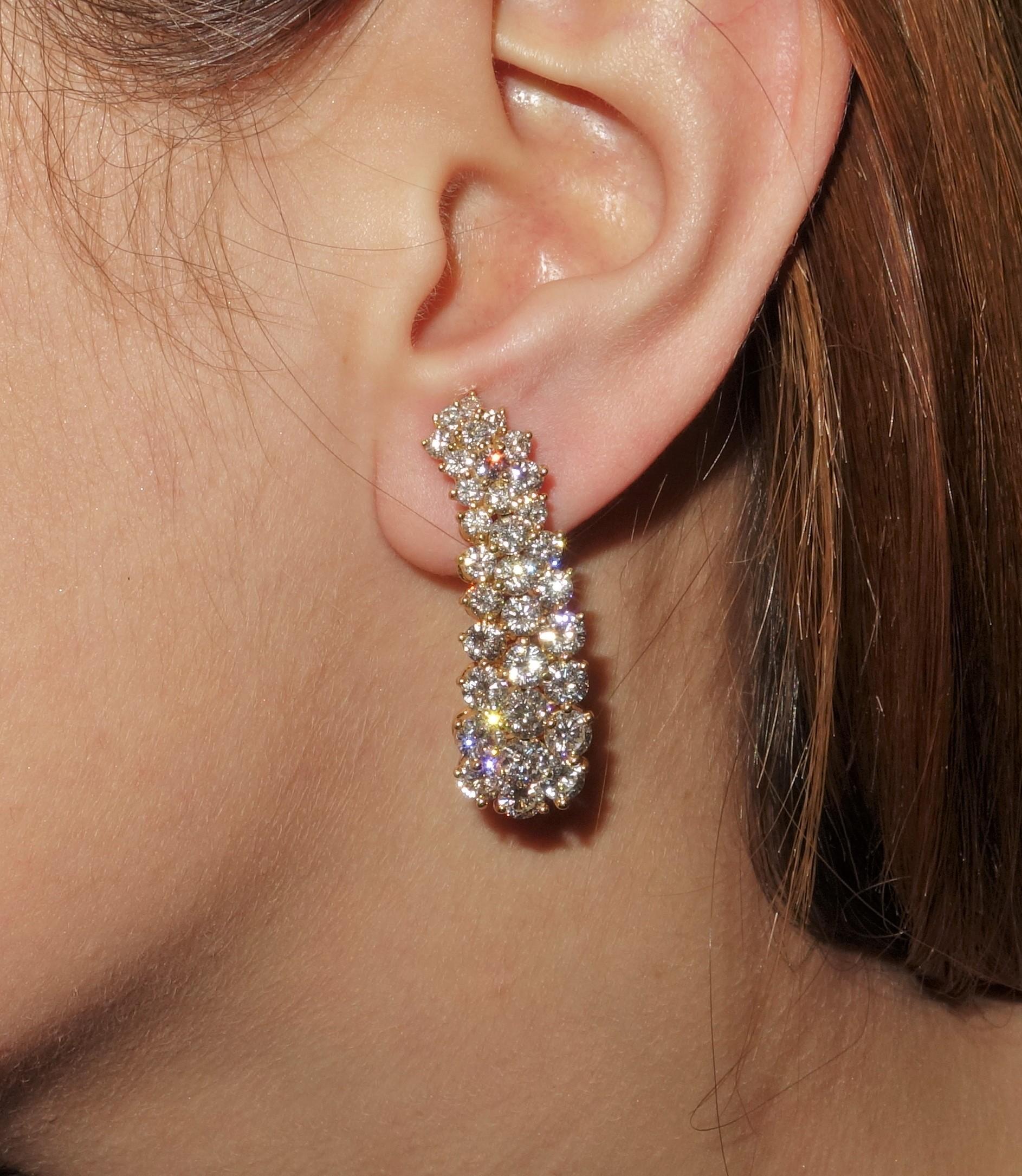 Stylish and Simply Beautiful Kurt Wayne Earrings featuring 7 Carat Diamonds; F color; VS2 clarity; Hand crafted in 18 Karat Yellow Gold. These earrings are attributed to Kurt Wayne and are fitted with a hinged clip-on backing. Ideal worn for day or