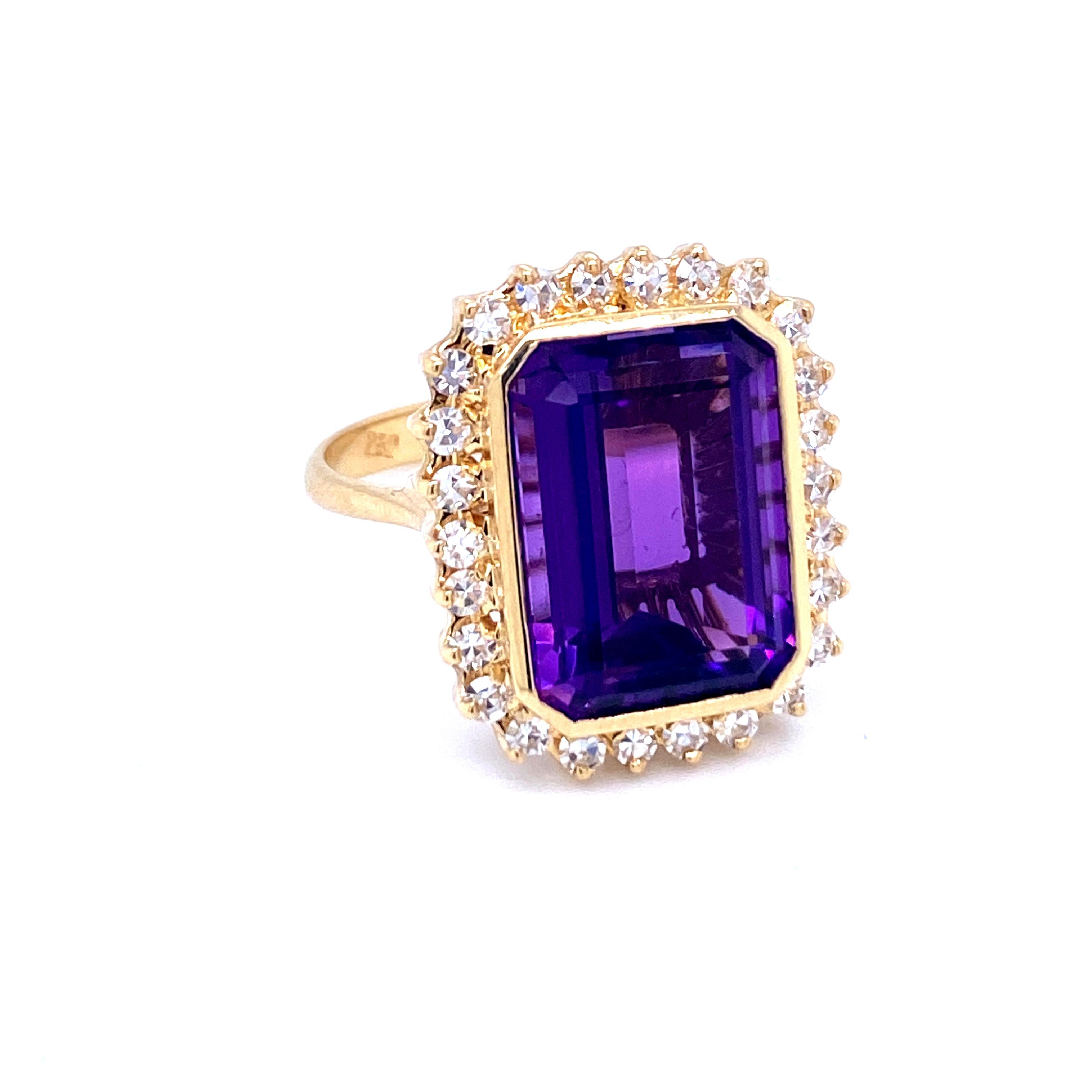 A fine and impressive 18k yellow Gold, Amethyst and Diamond cluster Ring, set in the center with an Emerald-cut Vivid Russian Natural Amethyst, of exceptional Color, clarity and cut, weighing 7 carats, flanked by 28 Round Brilliant cut diamonds