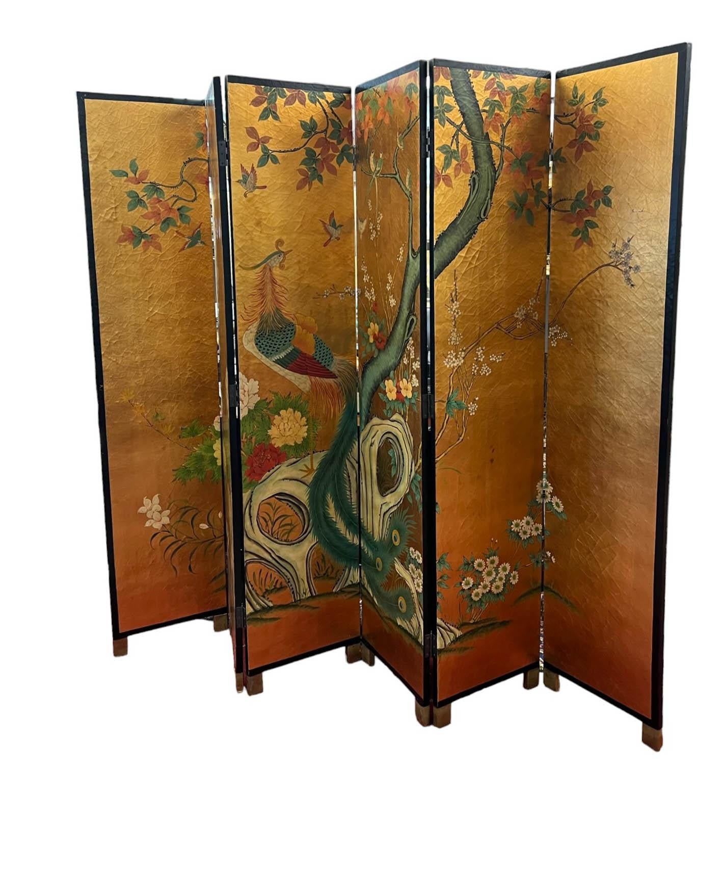Large Asian 6-panel folding screen. The screen stands seven feet tall and could be used in a multitude of applications. The front of the screen is finished in a crackled gold, depicting a large peacock in its center, smaller birds on branches up