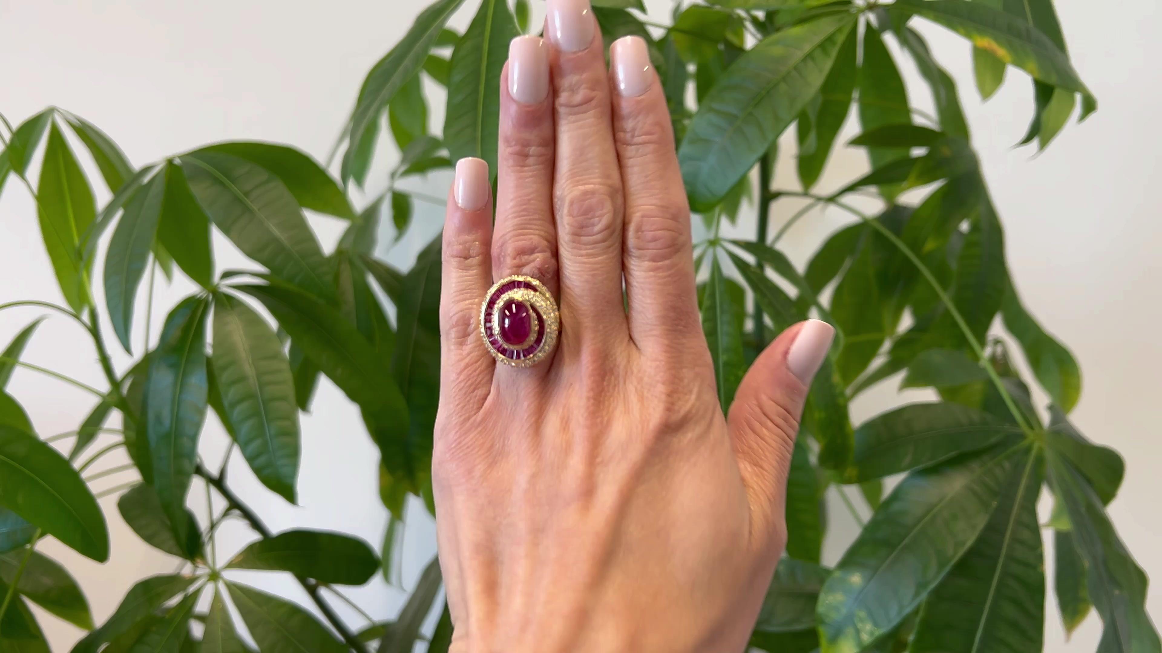 One Vintage 7.06 Carat Ruby and Diamond 18k Yellow Gold Swirl Cocktail Ring. Featuring one cabochon ruby of 7.06 carats. Accented by 26 rectangular step cut rubies with a total weight of 2.08 carats, and 112 round brilliant cut diamonds with a total