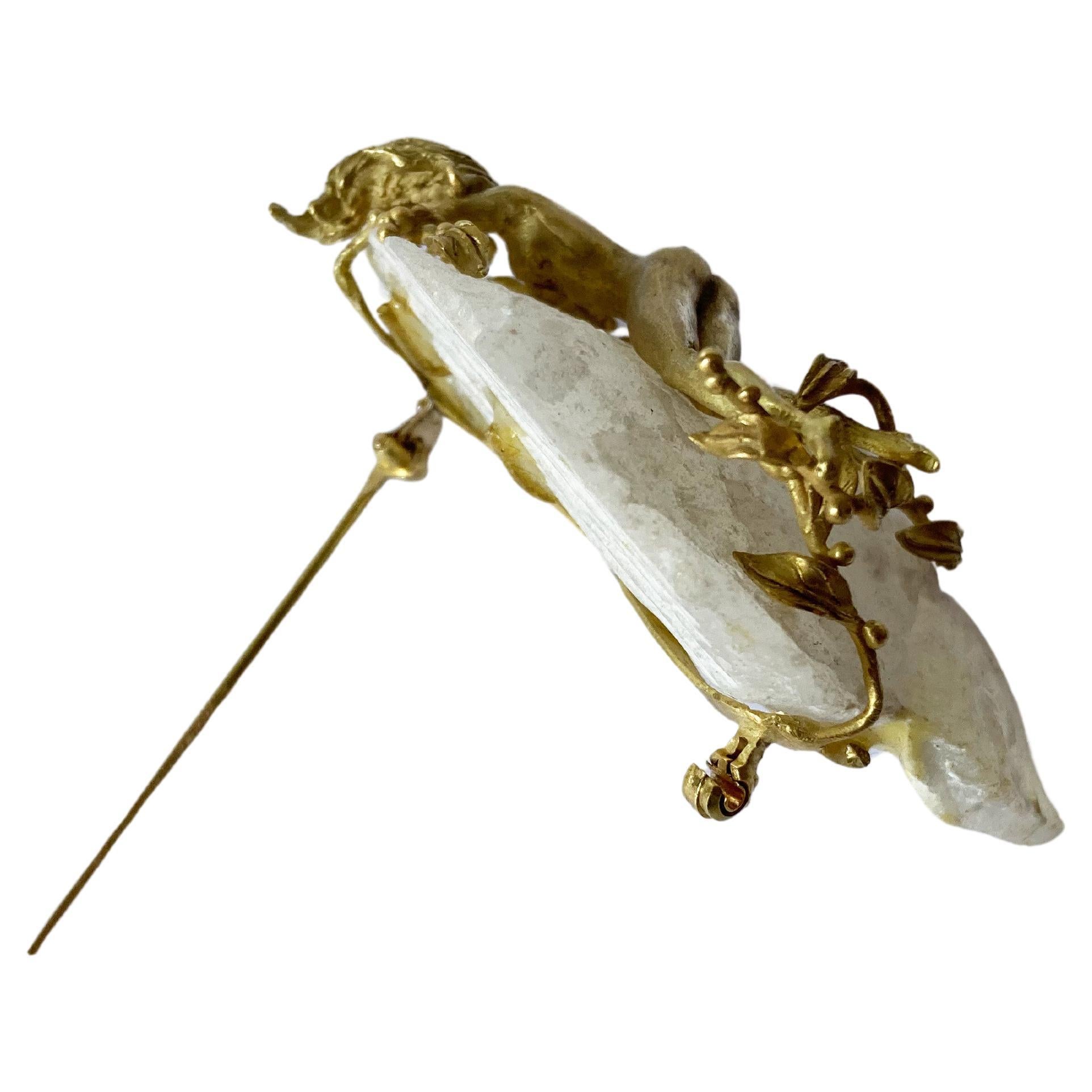 Step back in time to the enchanting 70s with this vintage Italian brooch, a one-of-a-kind piece that exudes artistic brilliance. Handcrafted in 18K yellow gold, it features a pristine, uncut Feldspar rock as its centerpiece - a testament to the raw