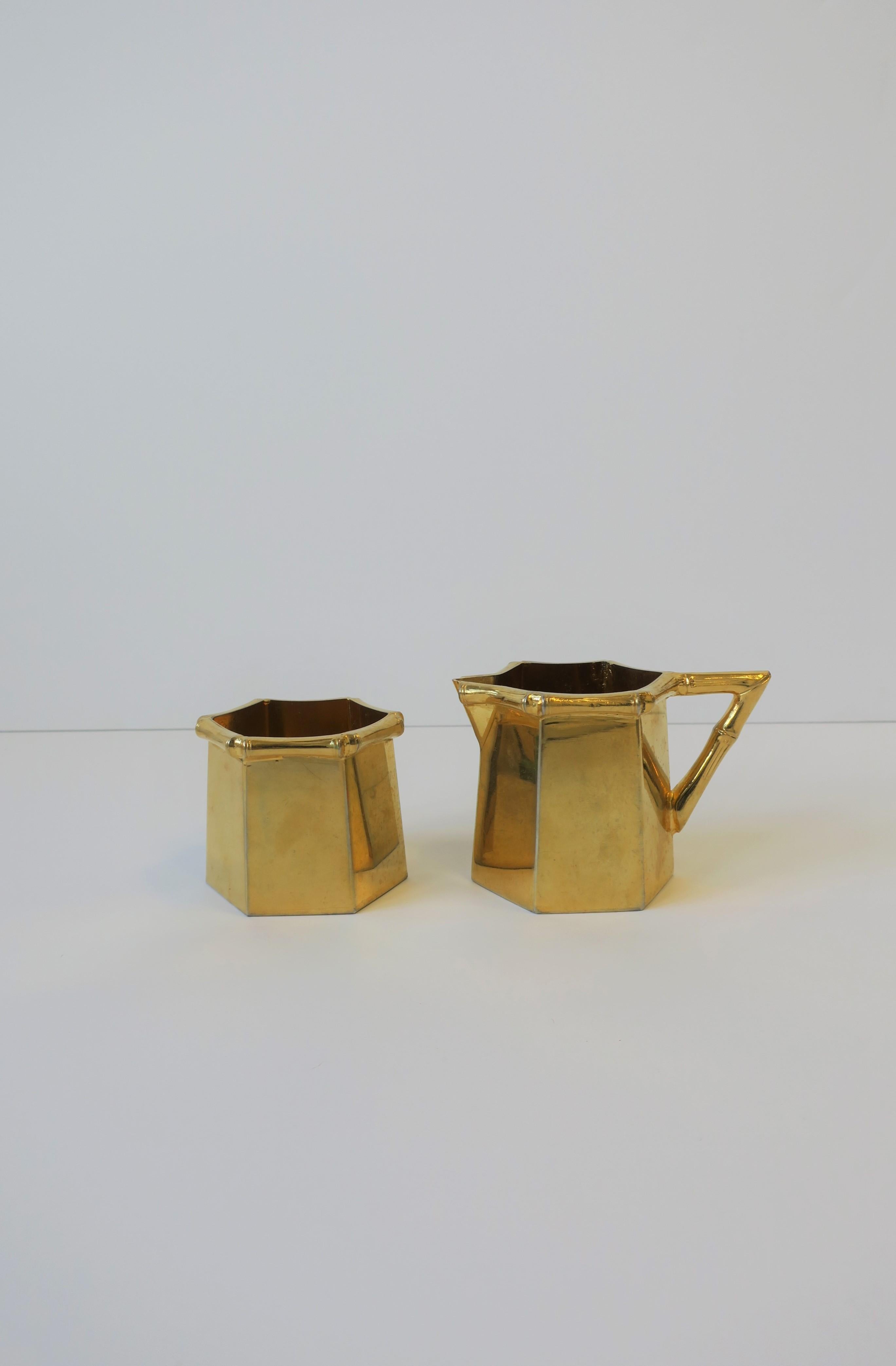A chic vintage 1970s brass plated tea/coffee creamer and sugar set with bamboo detail in the Hollywood Regency style. Great design style with bamboo details around edge and handle and a hexagon shape. A substantial set that can be used on a bar, bar