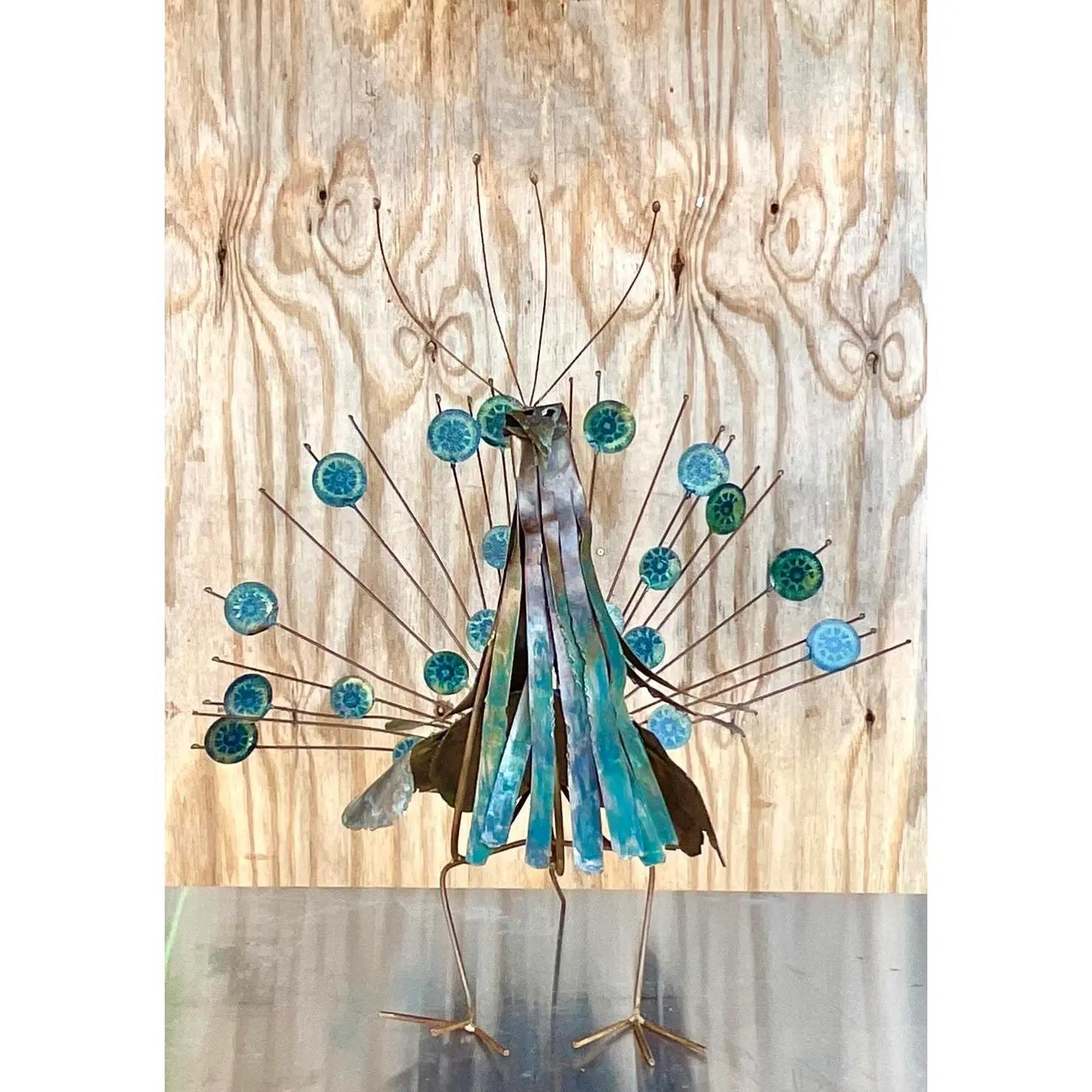 Stunning vintage midcentury Peacock sculpture. Large and impressive with a beautiful patina from time. Hand made Brutalist design with hand painted feathers. Acquired from a Palm Beach estate.