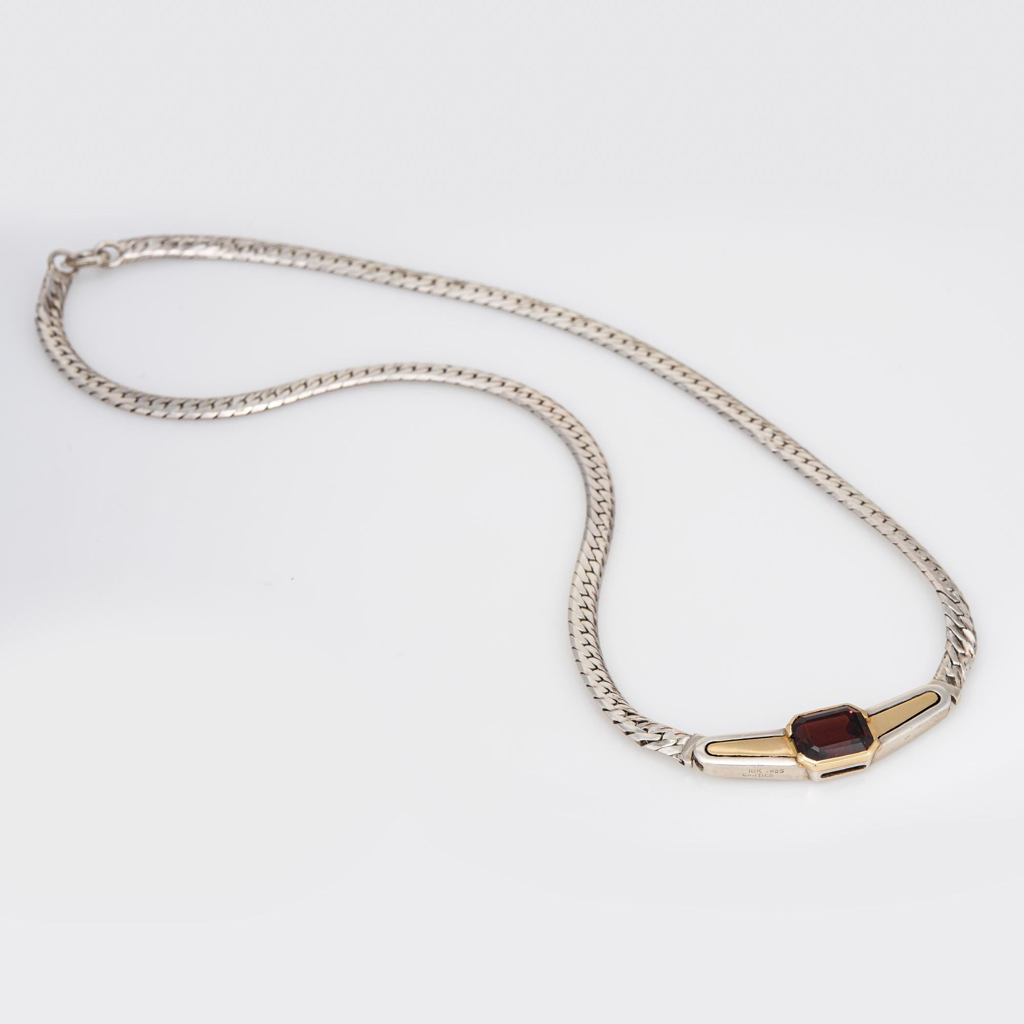 Stylish vintage Cartier garnet necklace crafted in sterling silver and 18 karat yellow gold (circa 1970s).  

One garnets measures 10mm x 7.5mm. The garnet is in very good condition and free of cracks or chips.
Designed in the Art Deco style, the