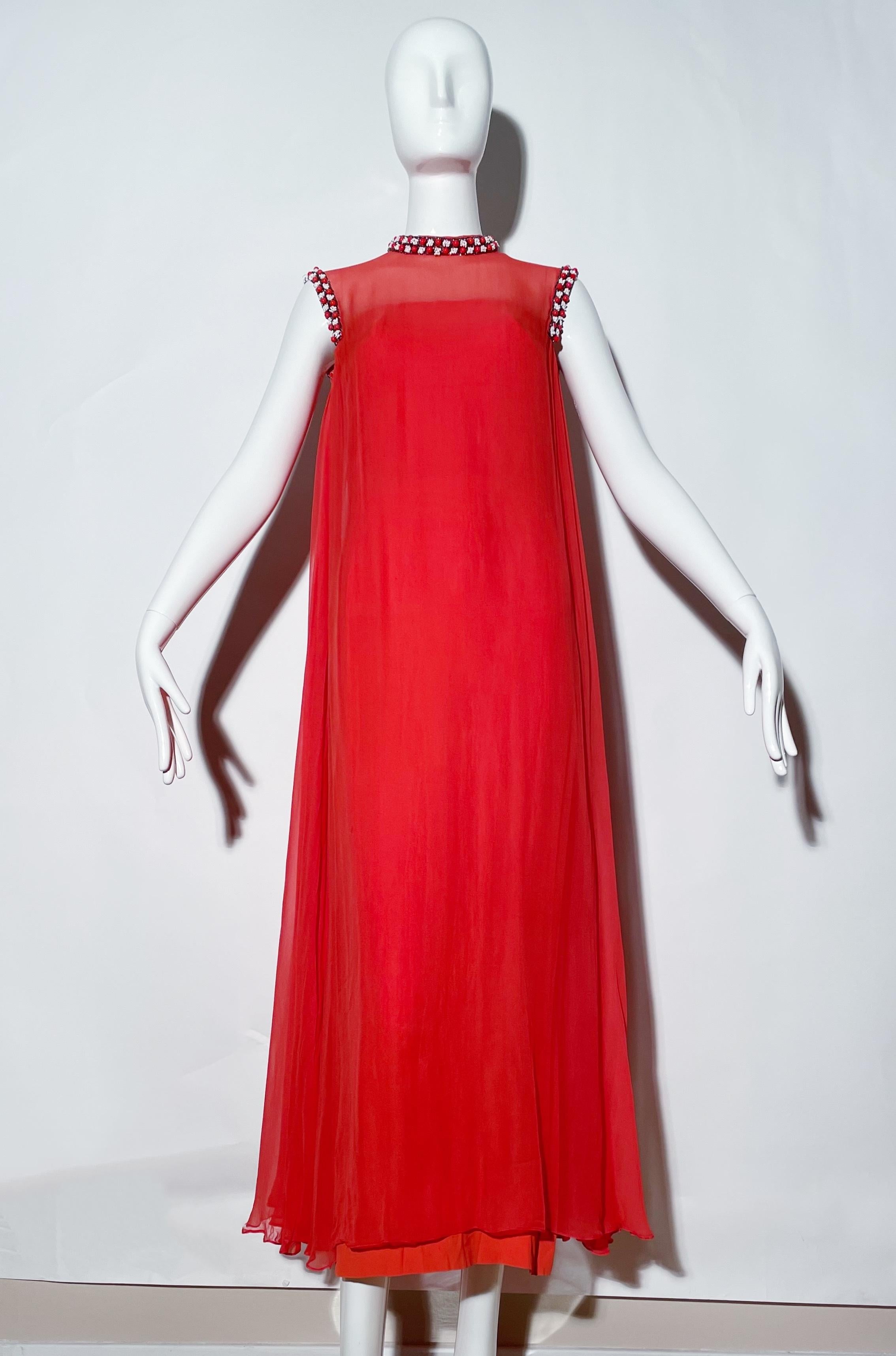 Coral silk floor length gown. Beaded neckline and armpit. Rear zipper closure. Rear button closures. Lined. 
*Condition: good vintage condition. Missing few beads around armpit. 

Measurements Taken Laying Flat (inches)—
Shoulder to Shoulder: 16