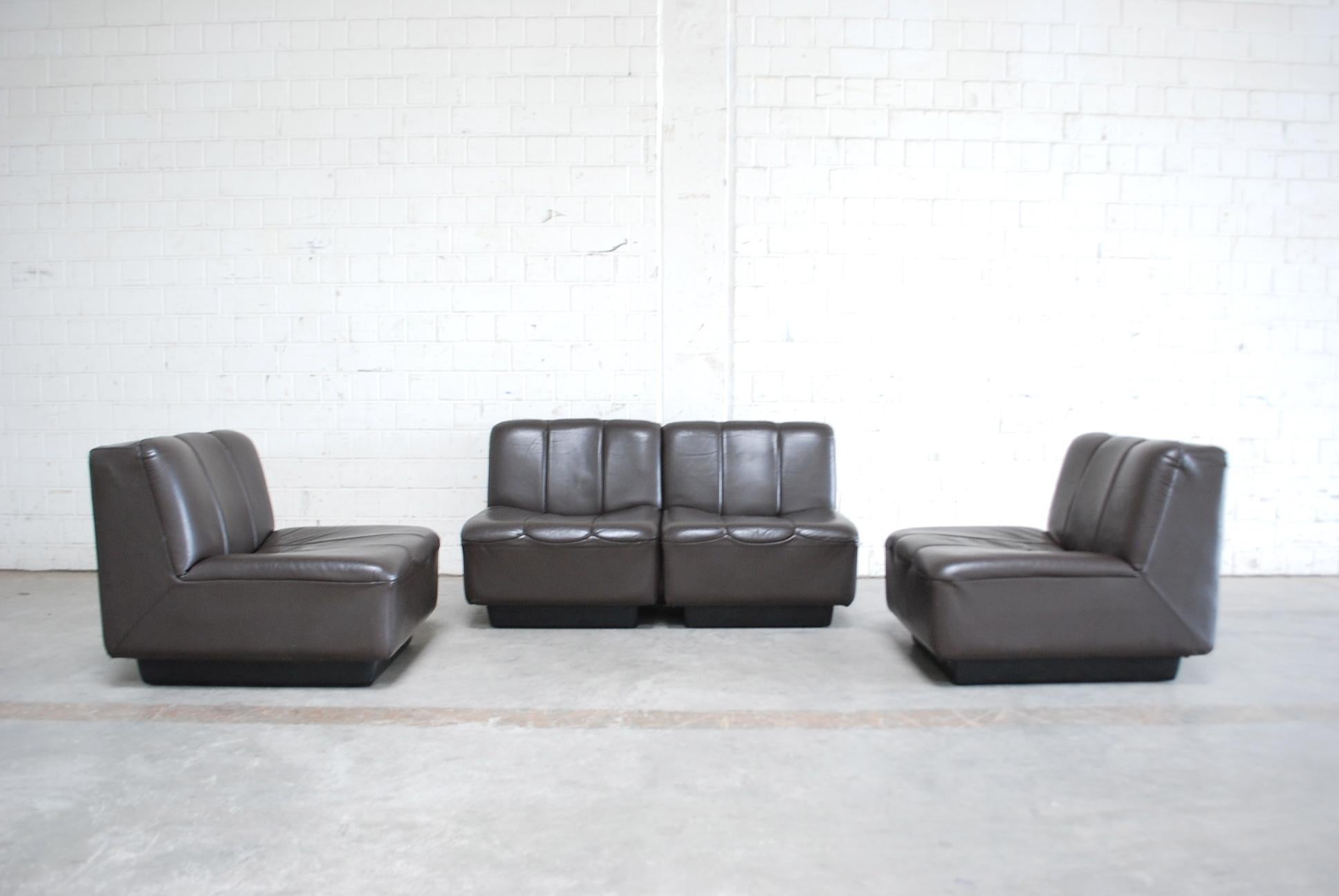 Vintage design leather sofa from Germany 1970.
Brown semianiline leather.
The frame is made of thick plastic.
It consists 4 single elements that can arrange in different positions or as 4 single chairs.

 