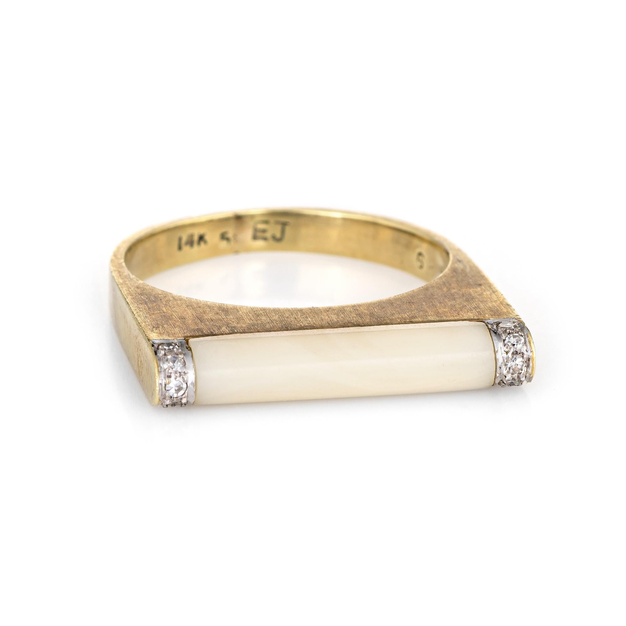 Stylish vintage white coral & diamond bar ring (circa 1970s) crafted in 14 karat yellow gold. 

White coral measures 16mm x 3mm, accented with an estimated 0.05 carats of diamonds (estimated at I-J color and SI1-2 clarity). The coral is in excellent