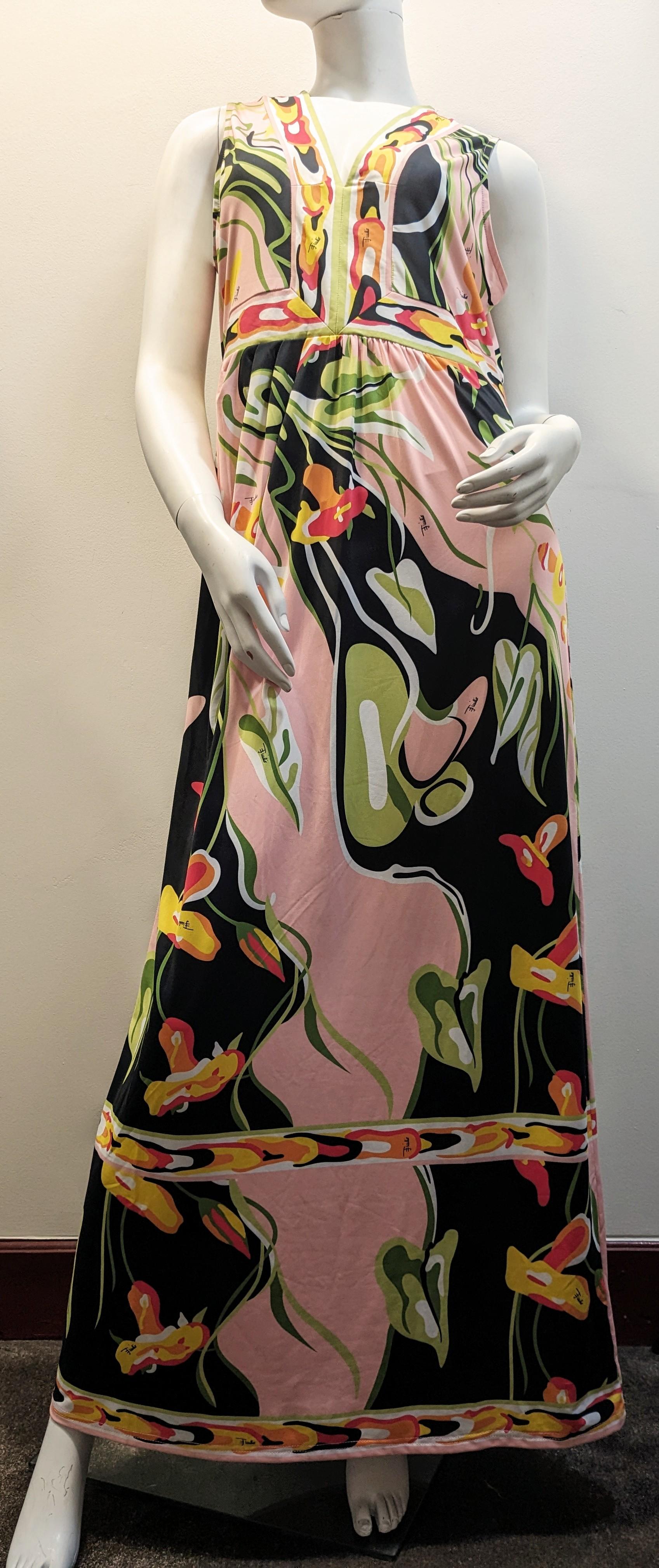 Vintage  EMILIO PUCCI Pink, Black and green Silk Psychelic and flowe Print Long Dress
Emilio Pucci Silk Jersey Maxi Dress with Banded, Contoured Bodice in Classic Pucci Print of Flowers,  Origami Motifs in Pink, green and black colours.  
Flattering