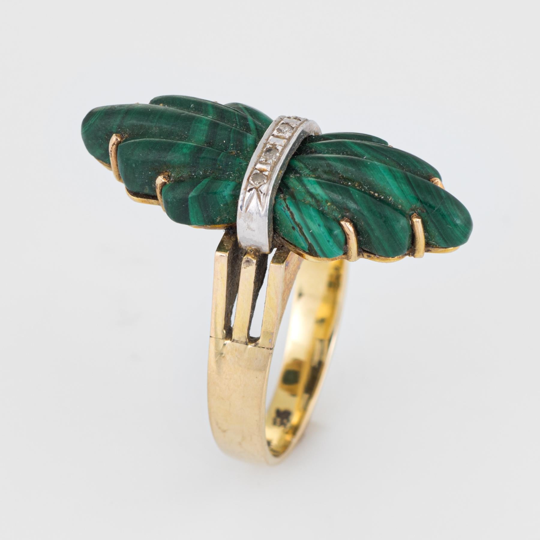 Finely detailed vintage fluted malachite & diamond cocktail ring (circa 1970s), crafted in 14 karat yellow gold. 

Fluted malachite measures 28mm x 10.5mm, accented with an estimated 0.03 carats of single cut diamonds (estimated at H-I color and SI1