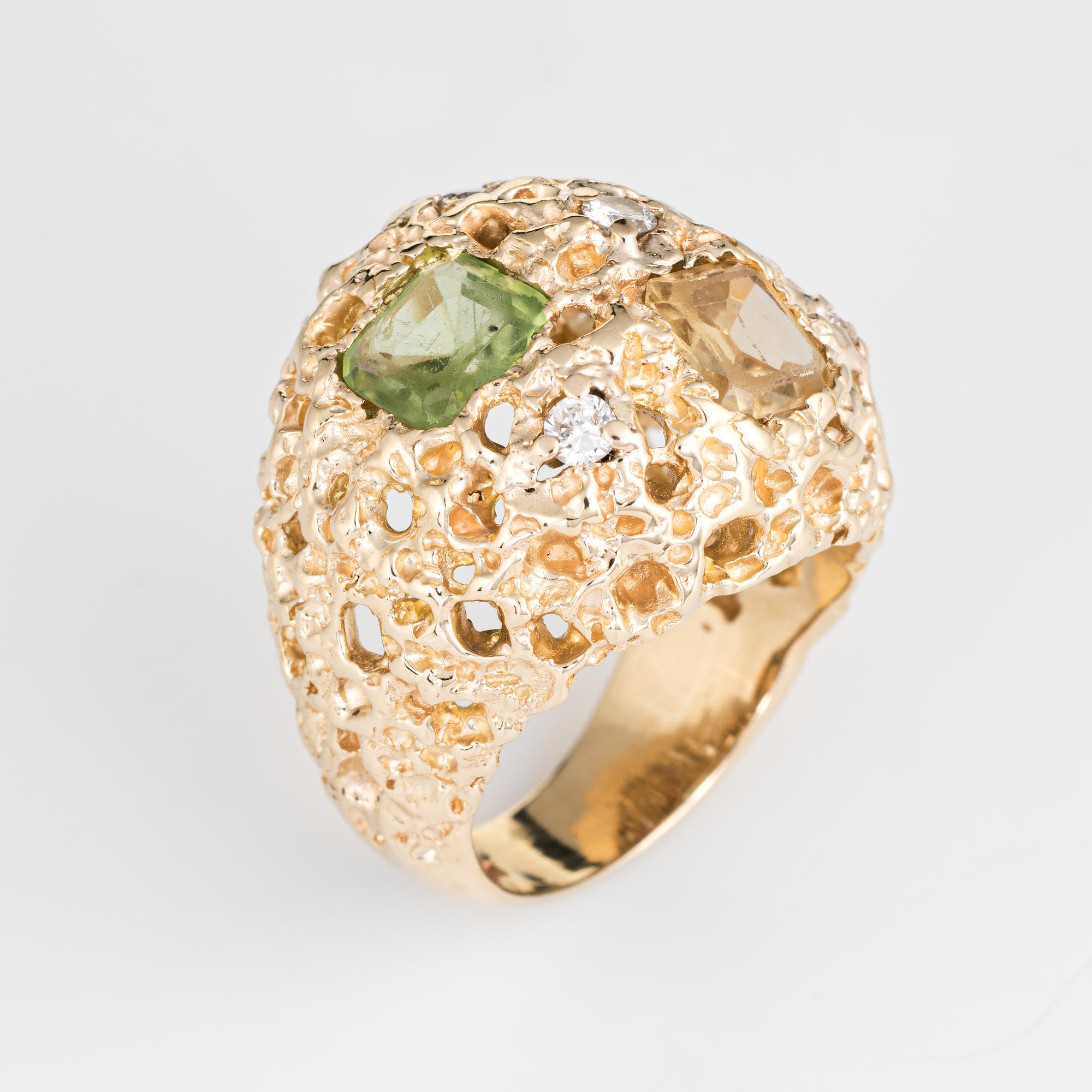 Stylish vintage gemstone dome cocktail ring (circa 1970s) crafted in 14 karat yellow gold. 

Square cut peridot, citrine and pink tourmaline each measure 7mm (estimated at 0.80 carats each - 2.40 carats total estimated weight). Four diamonds are