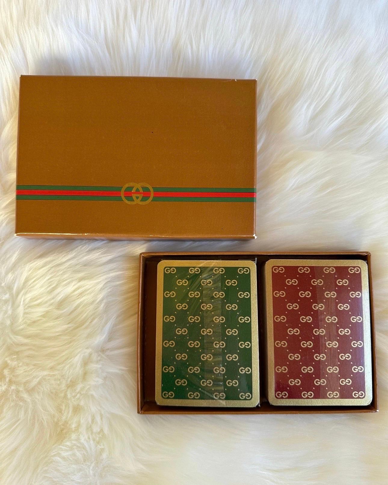 🖤 Gucci Game Night 🖤

Vintage 70s Gucci Playing Card Set

Poker just got a bit more glamorous!

This playing card set comes with two sealed decks of cards, one set of green monogram cards and another set of red monogram cards. The two decks of