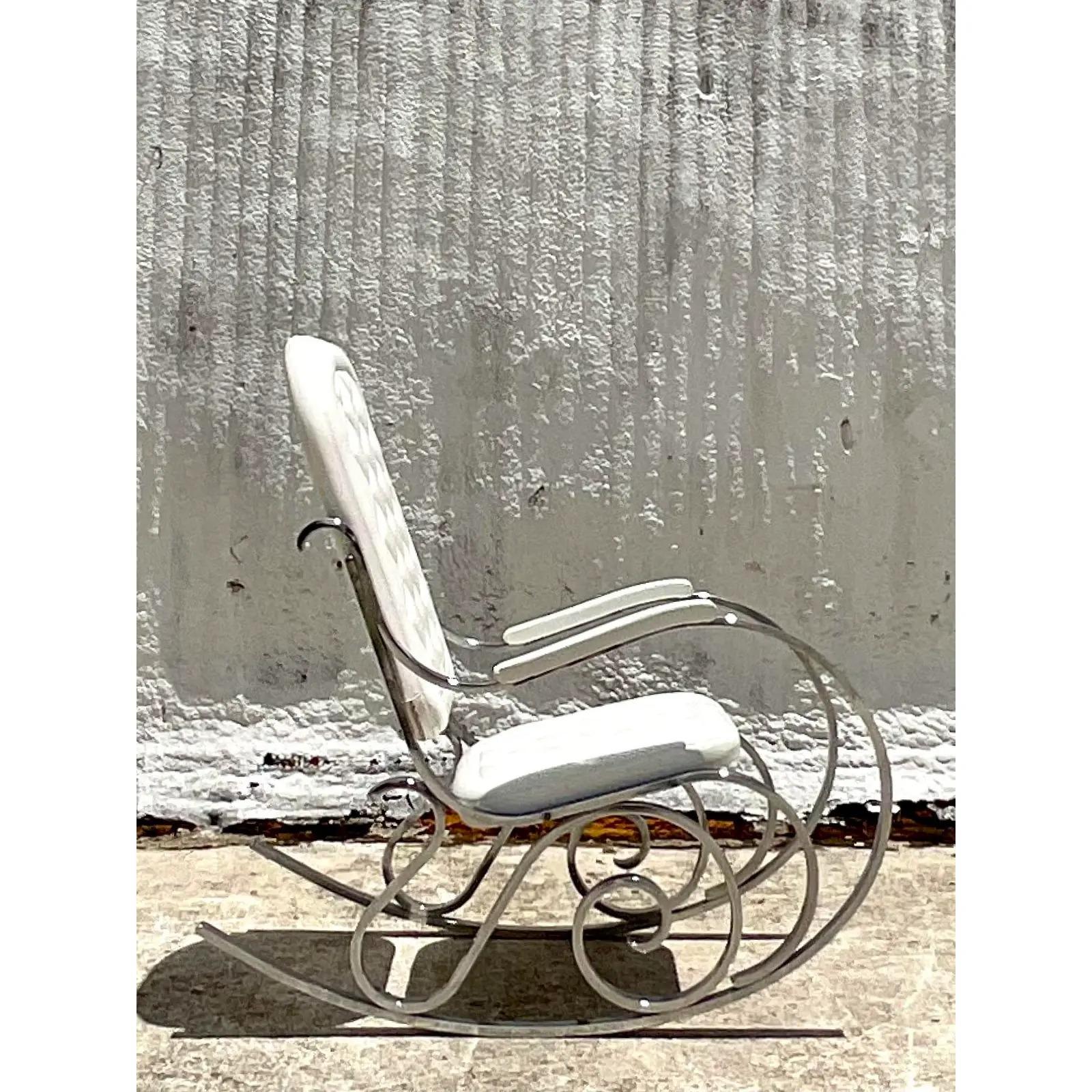 Fabulous vintage 70s chrome rocking chair. Beautiful iconic design made by the Madison Jansen group. White quilted upholstery. Acquired from a Palm Beach estate.