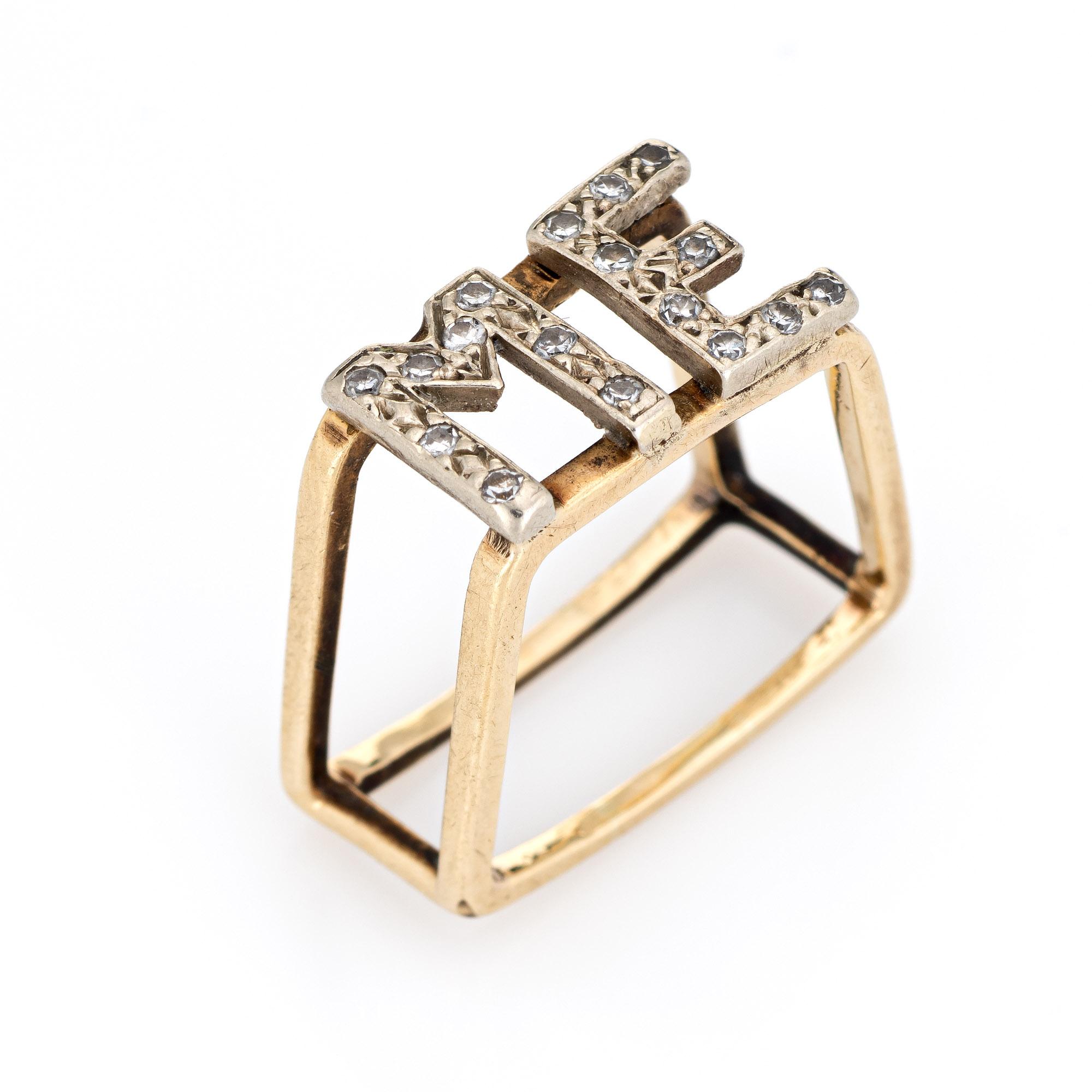 Stylish vintage initial ring crafted in 14 karat yellow gold (circa 1970s). 

16 single cut diamonds total an estimated .08 carats (estimated at I-J color and SI1-I2 clarity).  

The split shank square ring features the letters 