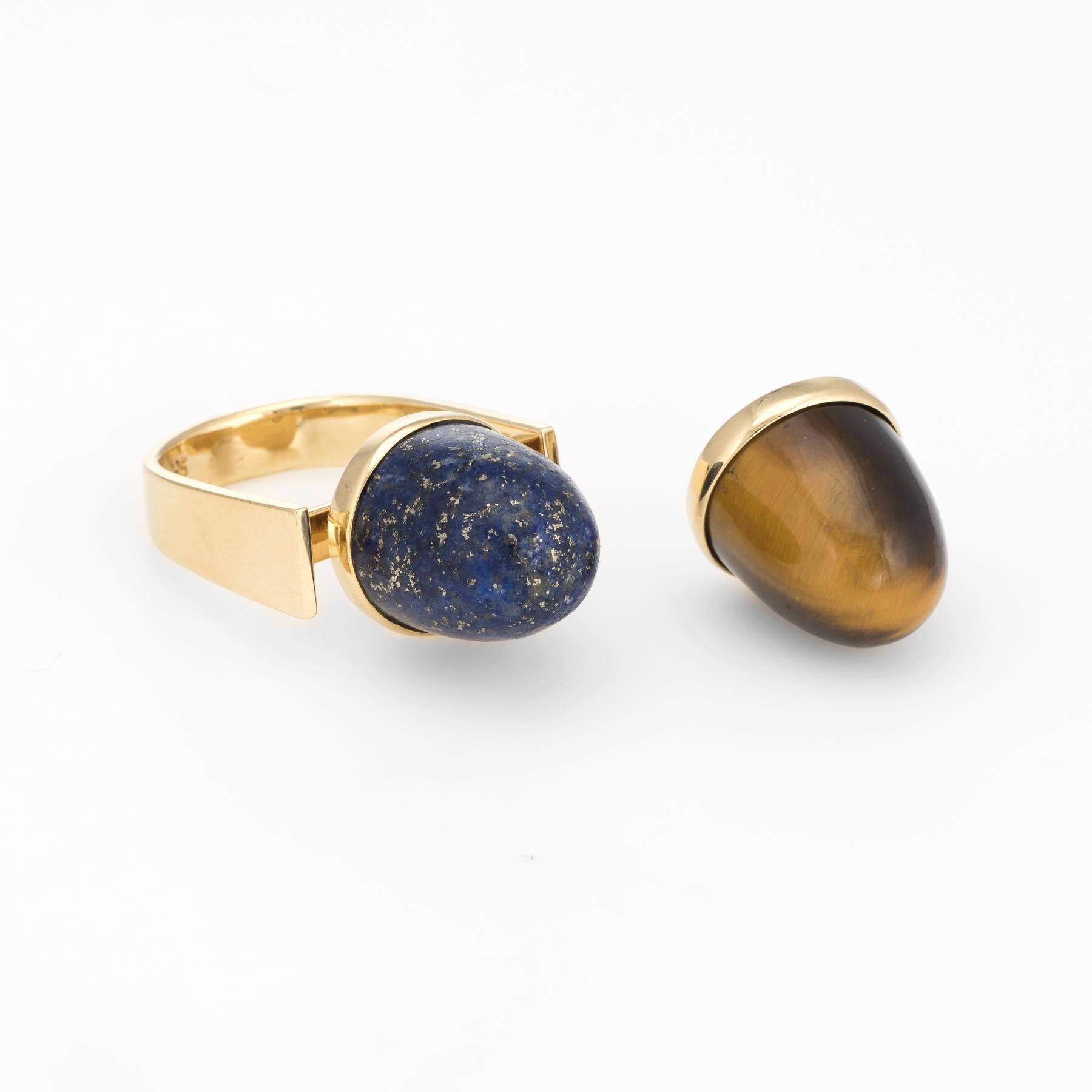 Circa 1970s, a statement cocktail ring with interchangeable components, crafted in 14 karat yellow gold. 

Lapis lazili & tigers eye measures 12mm x 12mm (both in excellent condition and free of cracks or chips).  

The unique ring features an