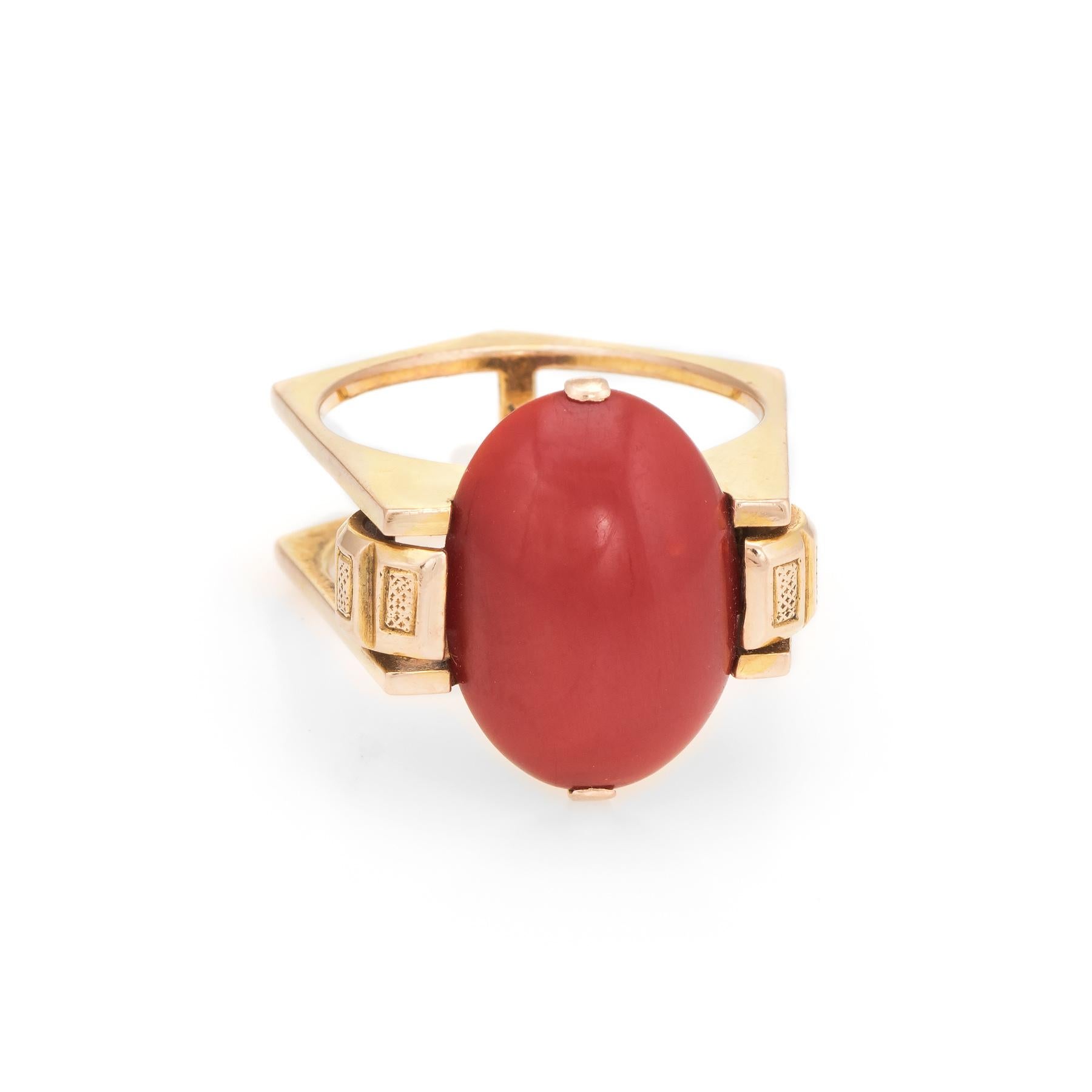 Distinct & stylish Mediterranean red coral cocktail ring (circa 1970s), crafted in 14 karat yellow gold. 

Centrally mounted Mediterranean red coral measures 16mm x 10mm (estimated at 7 carats). The coral is in excellent condition and free of cracks