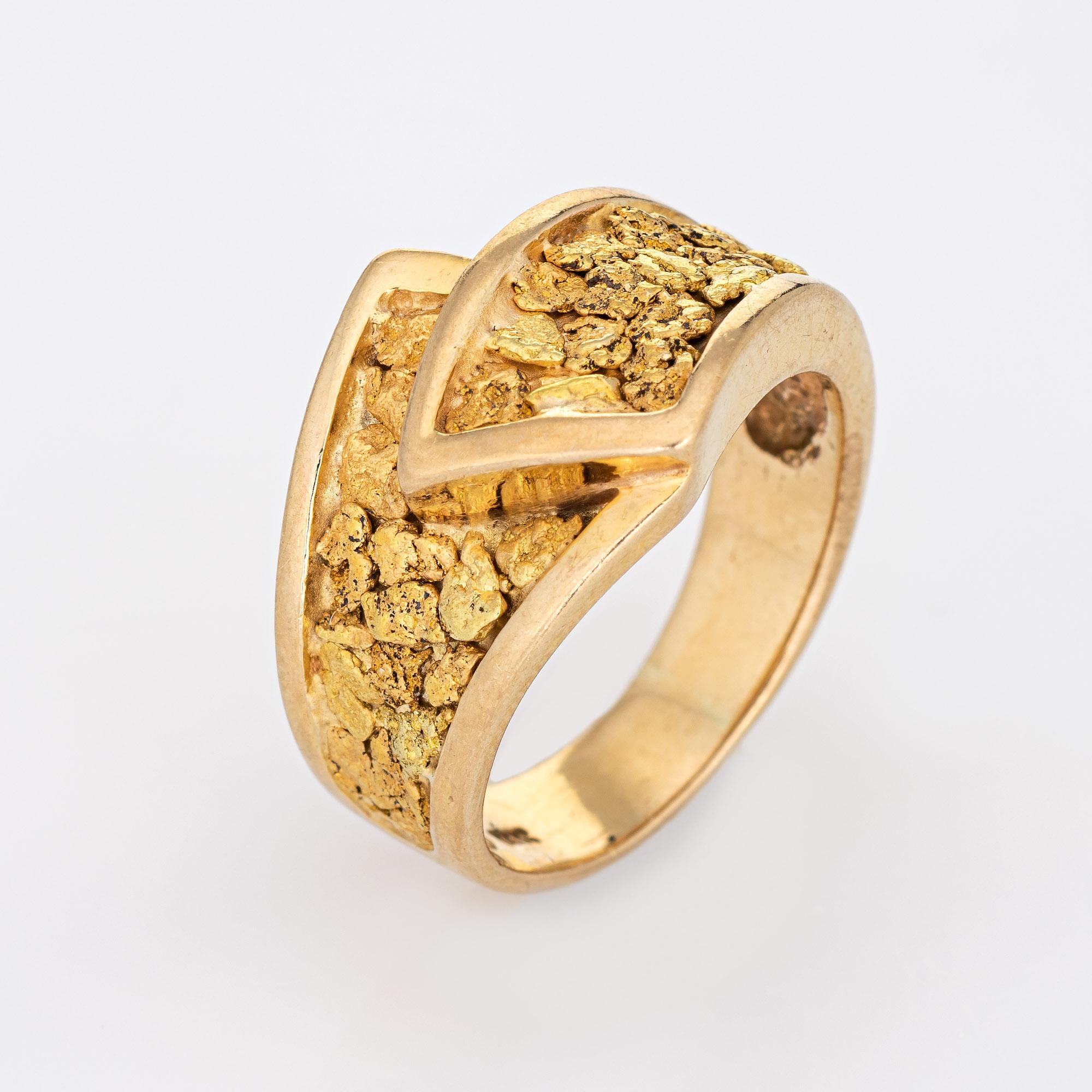 Stylish vintage nugget bypass ring (circa 1970s) crafted in 14 karat yellow gold (the gold nuggets are 22k to 24k gold). 

The band is set with natural mined from the earth gold nuggets. The gold nuggets glow in a rich buttery yellow color. The ring