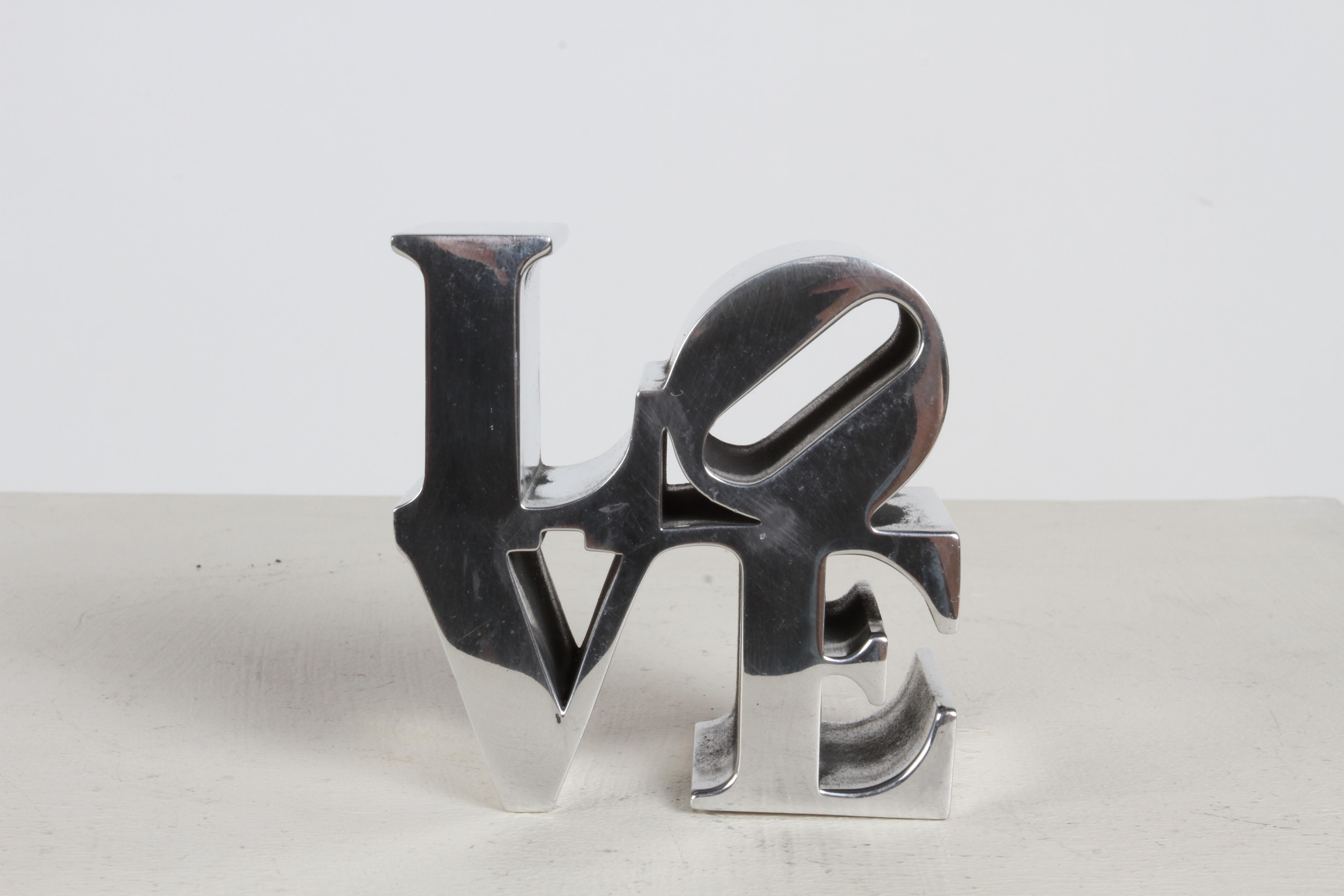 Authentic vintage 1970s after Robert Indiana LOVE sculpture, makes a great desk accessory. These were at one time sold in museum stores , such as MOMA. Robert Indiana's original love painting from the 1960s put him on the map as a major artist. Has
