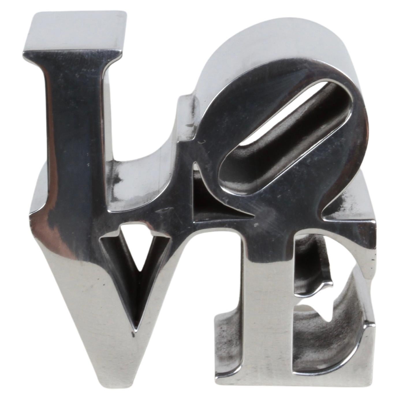 What does the Love sculpture represent?