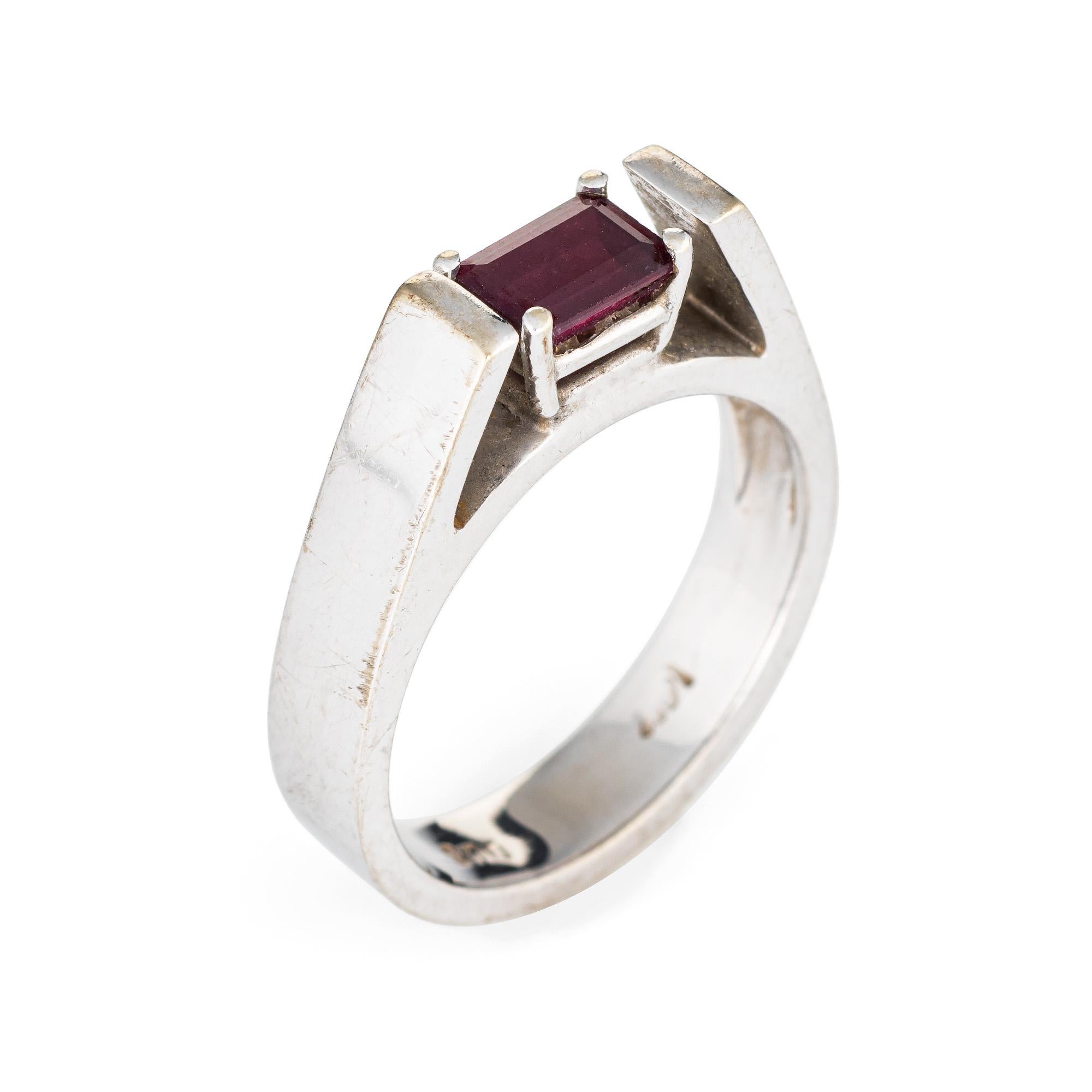 Stylish vintage rhodolite garnet ring (circa 1970s) crafted in 14 karat white gold. 

Rhodolite garnet measures 6mm x 4mm (estimated at 0.50 carats). The garnet is in excellent condition and free of cracks or chips. 

The raspberry hued garnet is