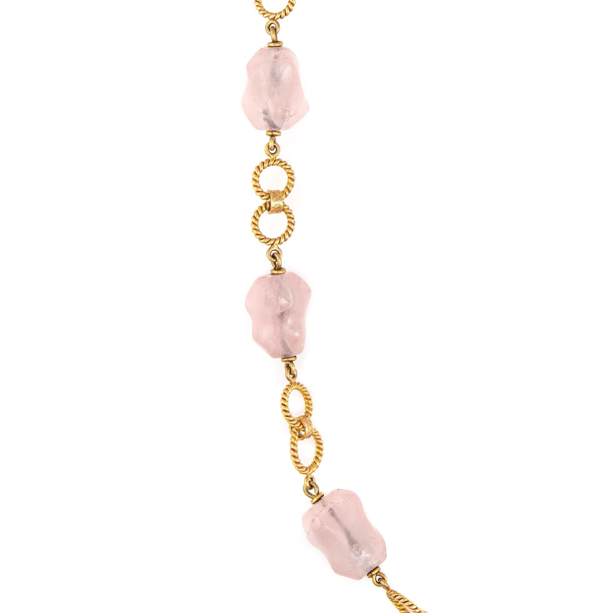 Finely detailed vintage rose quartz necklace crafted in 14 karat yellow gold (circa 1970s). 

Rose quartz beads measure (average) 3/4 x 1/2 inch (in very good condition and free of cracks or chips).

The stylish necklace features musky pink rose