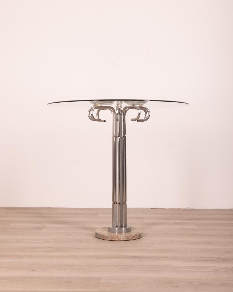 Table with marble base, chromed metal structure and round glass top, 70s.

Condition: In good condition, it shows signs of wear caused by time.

Dimensions: Height 83 cm; Diameter 89cm

Materials: Marble, Metal and Glass

Year of production: