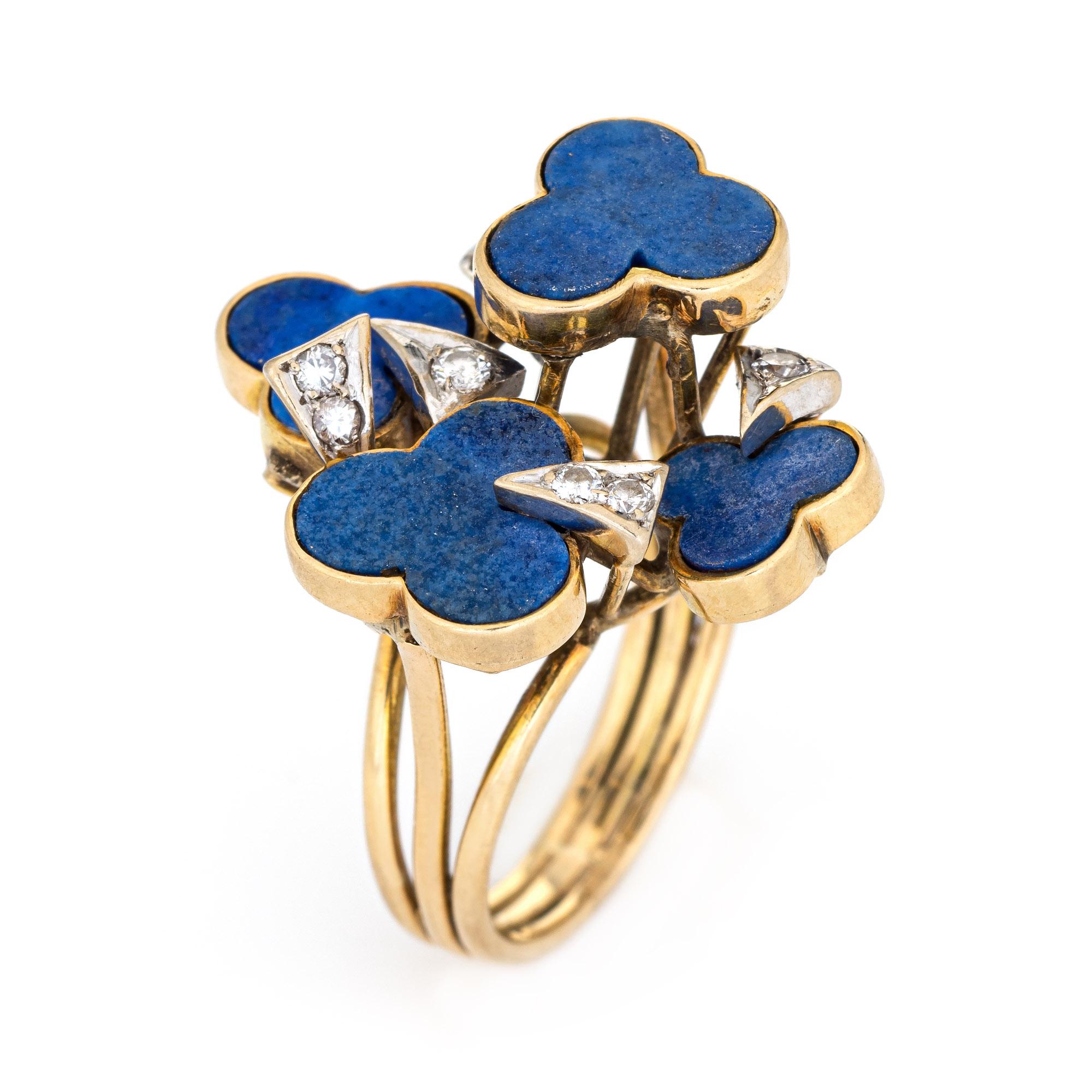 Stylish vintage Shamrock ring set with lapis lazuli & diamonds (circa 1960s to 1970s) crafted in 14 karat yellow gold. 

Lapis lazuli is inlaid into the mounts measuring 9mm. 9 diamonds total an estimated 0.05 carats (estimated at H-I color and