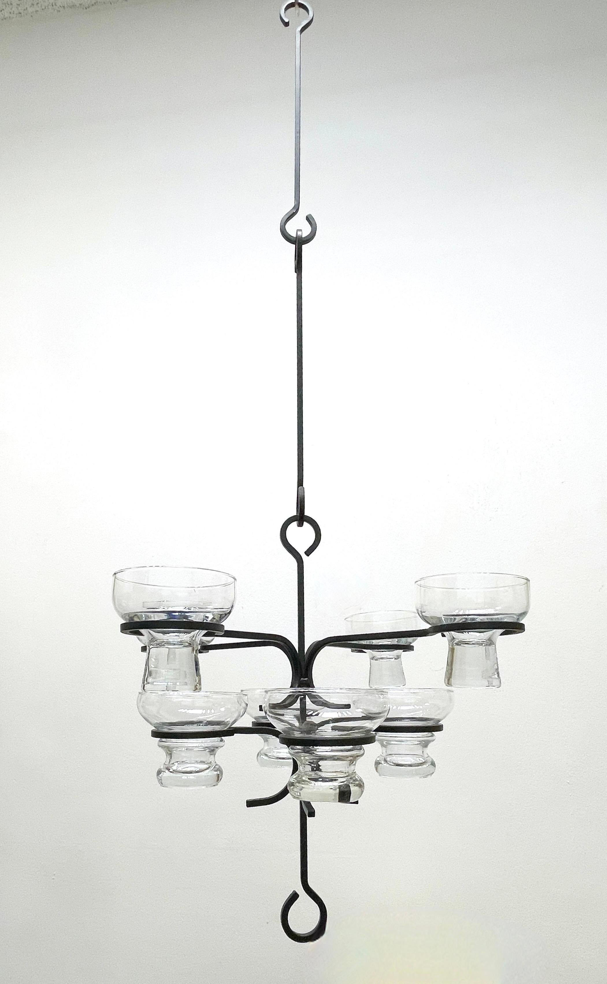 Add a touch of opulence to your home with this charming candle chandelier! This 60s Wrought Iron Chandelier with eight Swedish Art Glasses holds ball globe candles which are not included.
The Chandelier part is approx. 15.25