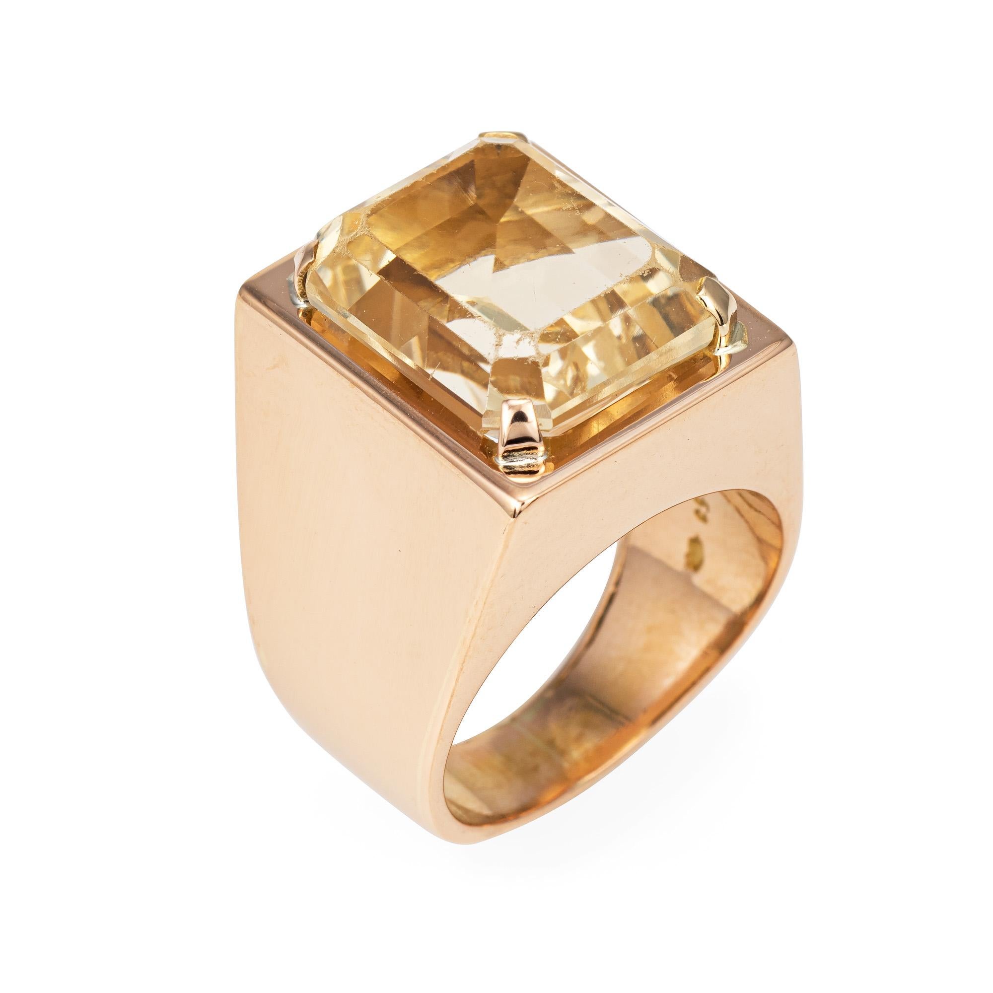 Stylish vintage yellow quartz ring (circa 1970s) crafted in 18 karat soft rose gold. 

Emerald cut yellow quartz measures 15mm x 12.5mm (estimated at 13 carats). The quartz shows some wear with surface abrasions visible under a 10x loupe. 

The