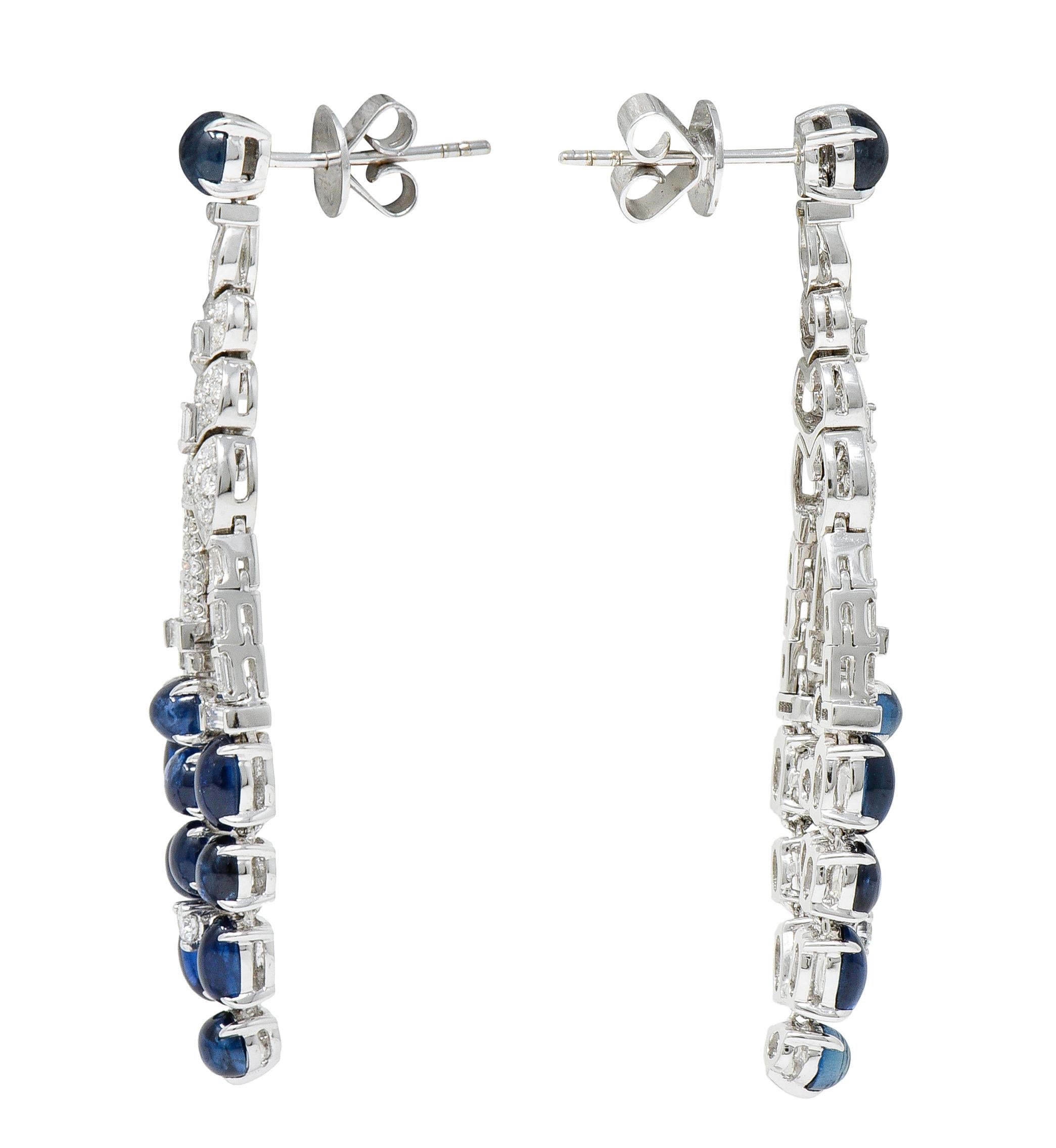 Drop earrings are designed with articulated white gold links - chandelier in style

With a round sapphire cabochon surmount and drop terminates as clustered sapphire cabochons

Very well matched in bright blue color and semi-transparent with natural