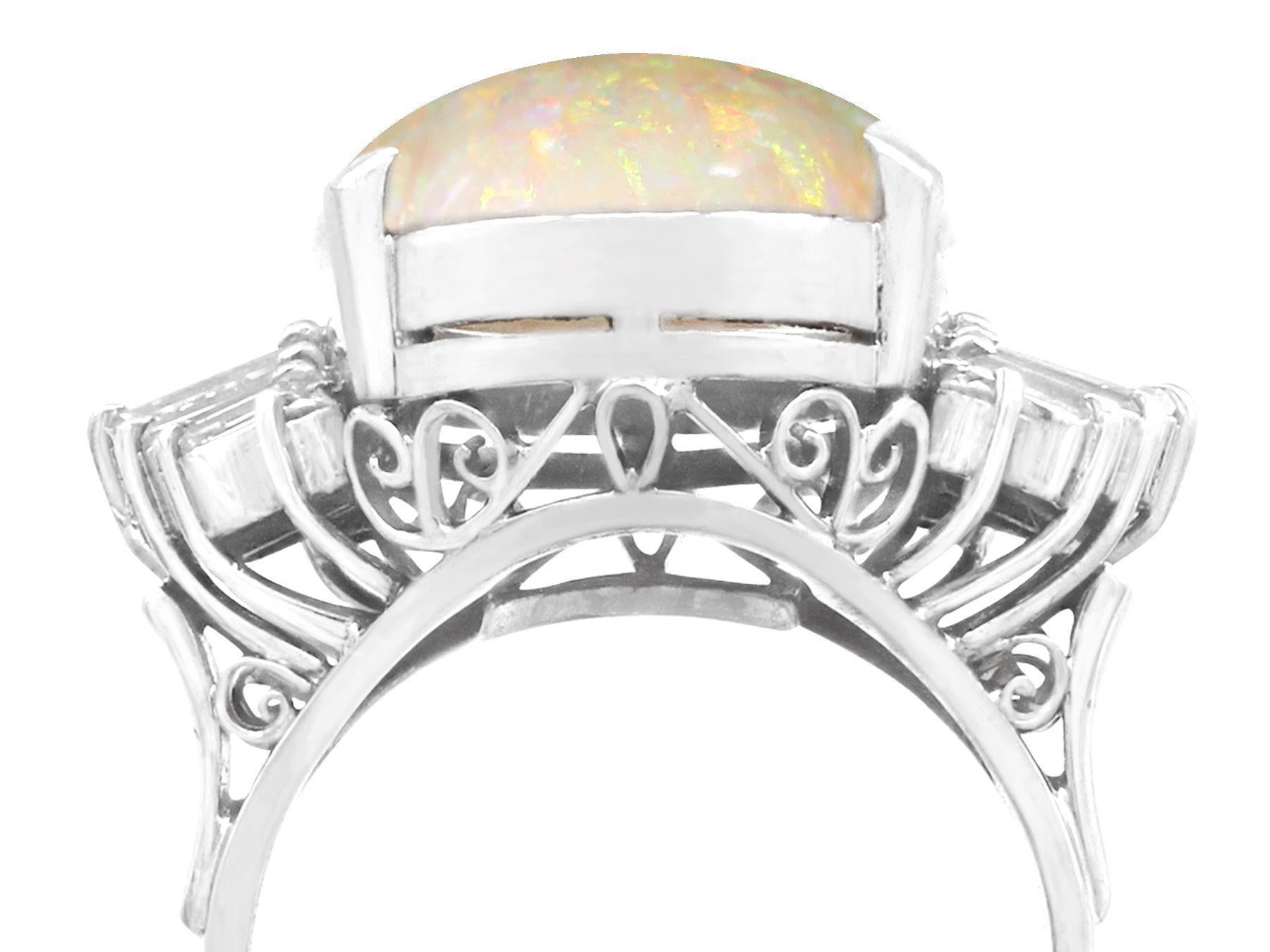 A stunning, fine and impressive vintage 7.39 carat opal and 0.82 carat diamond, platinum dress ring; part of our diverse vintage jewelry and estate jewelry collections.

This stunning vintage cabochon cut opal cocktail ring has been crafted in