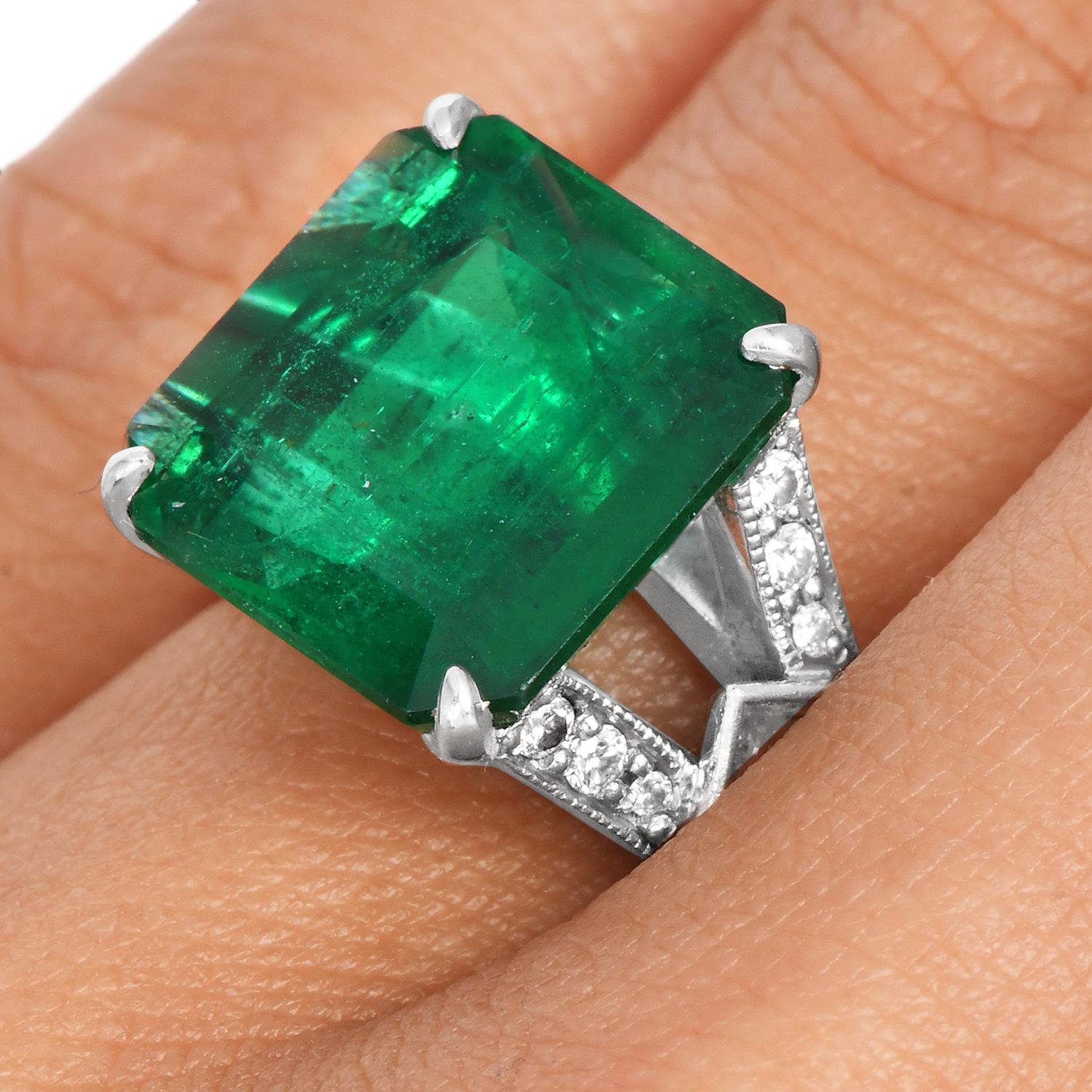 Treat yourself to this irresistibly stunning 5.93 carat emerald diamond platinum ring! 

Crafted in platinum with the center deep green emerald of approximately 5.93 carats. The vivid, and transparent hue of the emerald is complimented with two