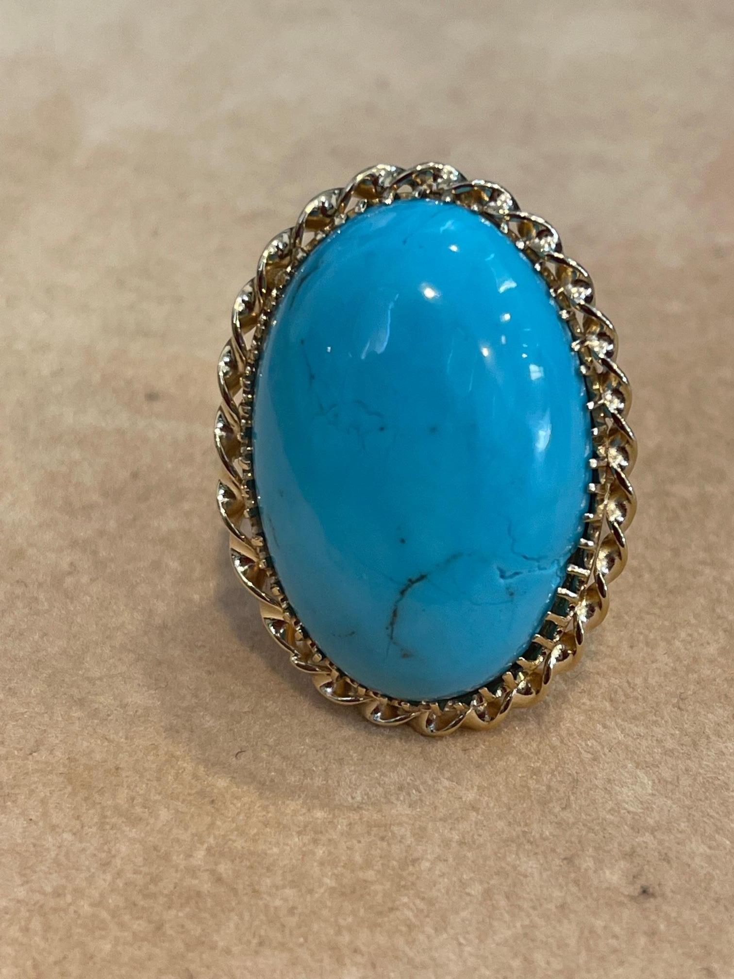 
Vintage 75 Ct Natural Oval Sleeping Beauty Turquoise Ring, 18 Kt Yellow Gold
18 karat gold 26 Grams with stone
 Natural Sleeping beauty Turquoise 
color is very beautiful but there are some tiny cracks in the stone. Please look at the pictures.
