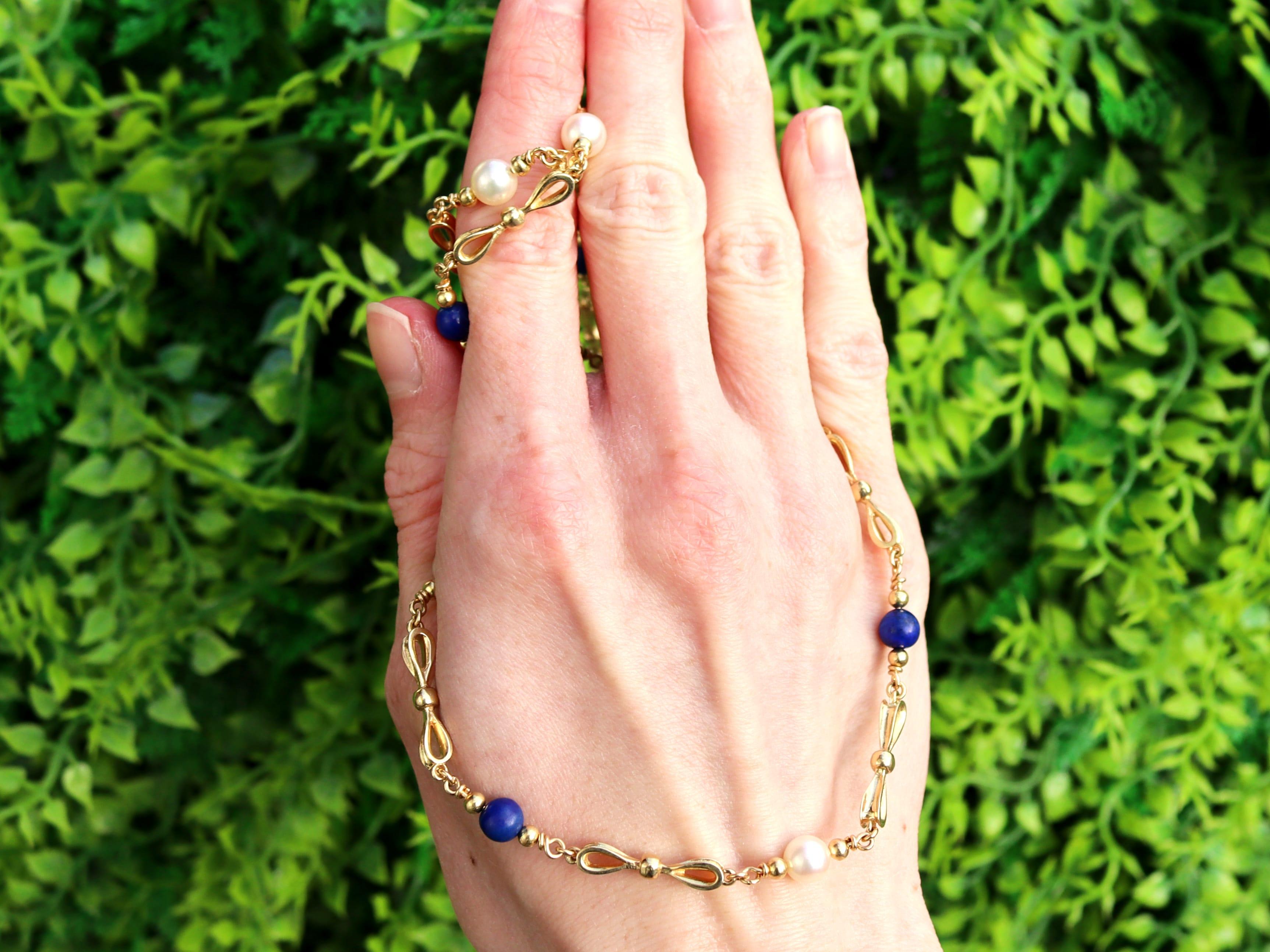 An exceptional, fine and impressive, vintage 7.80 carat lapis lazuli, pearl and 18k yellow gold chain necklace; part of our diverse collection of vintage necklaces.

This exceptional, fine and impressive vintage necklace has been crafted in 18k