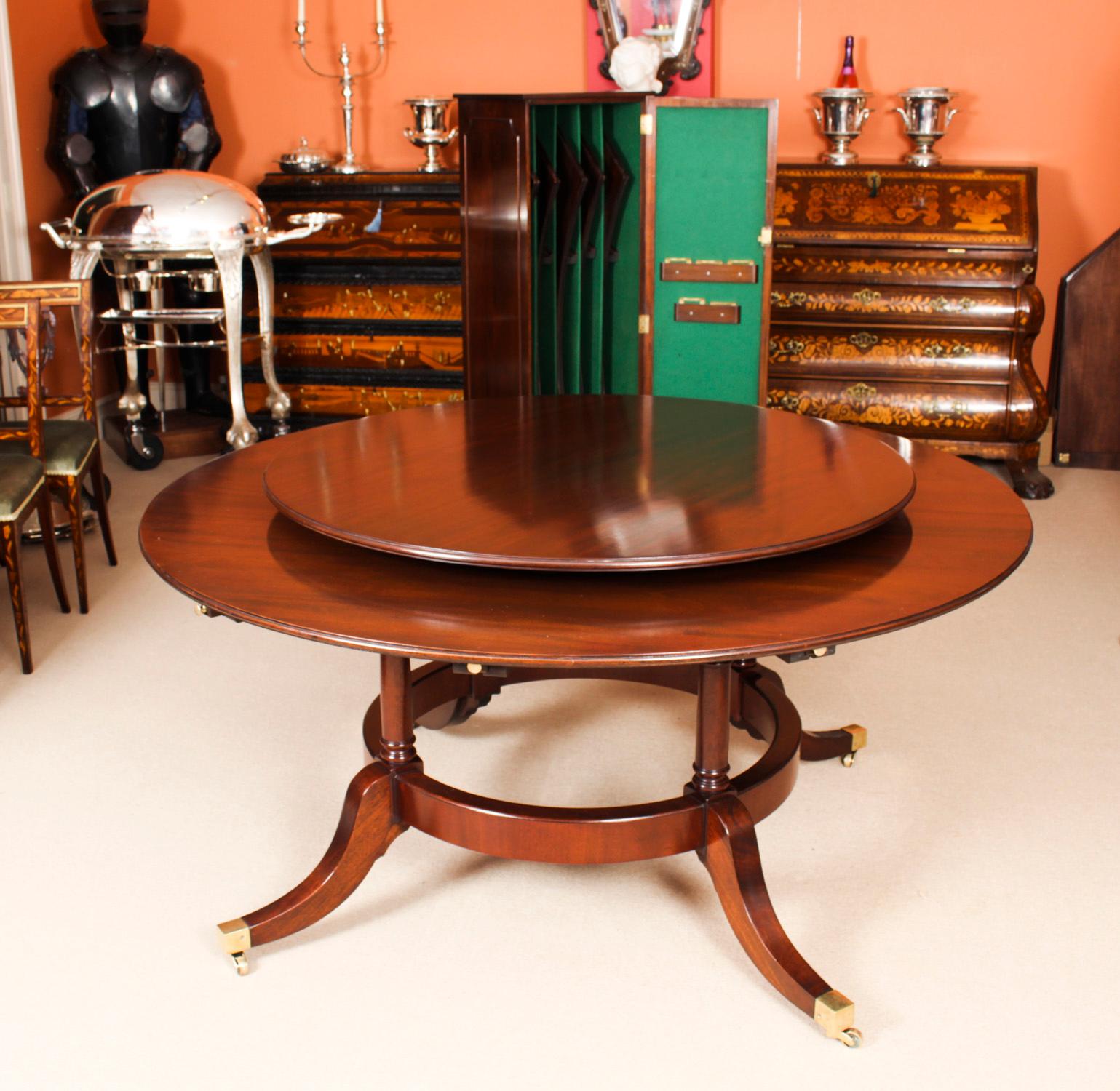 This beautiful dining set comprises a Regency Revival Jupe style dining table mid 20th century in date, with the original matching lazy susan.

The table has a solid mahogany top with five peripheral leaves that can be added around the circumference