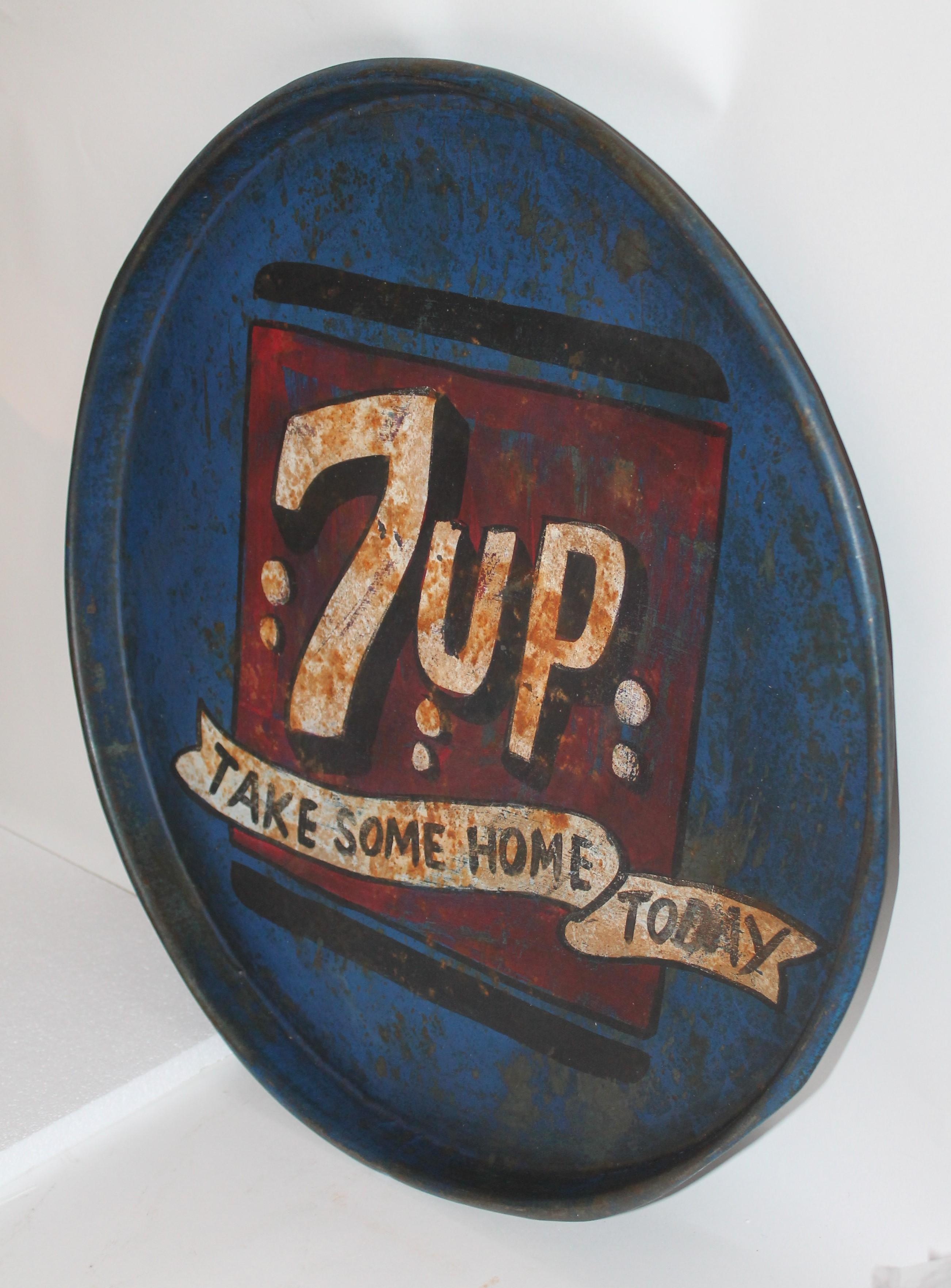 Fantastic and aged 7up soda tray in original age and worn paint. This is a oversized tray and does have pit marks and distressed in areas.