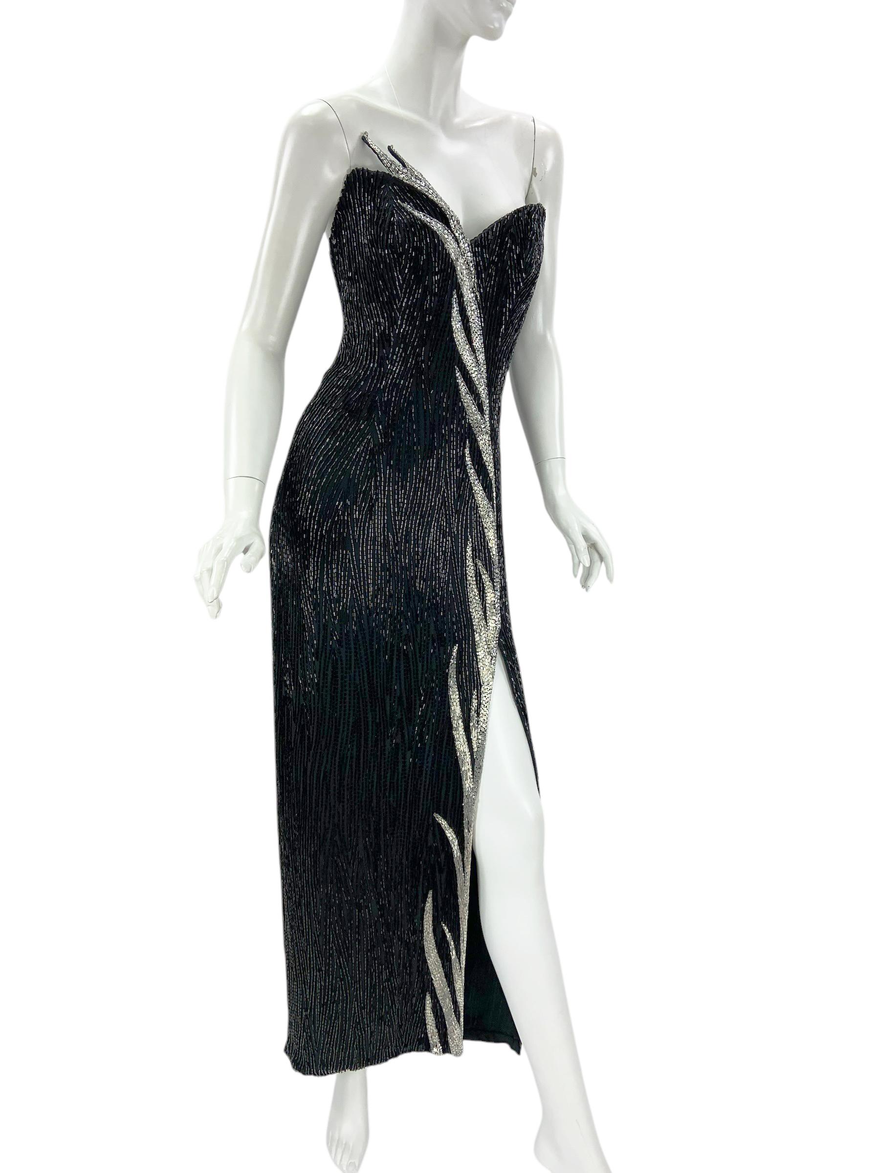 Vintage 80's Bob Mackie Boutique Black Fully Beaded Silk Evening Dress Gown
Designer size 6 ( modern size will be smaller - pls. read measurements).
Hand Beaded, Thousands of Black Beads  Over the Black Silk, Silver Leaves Design at the Front.
Built