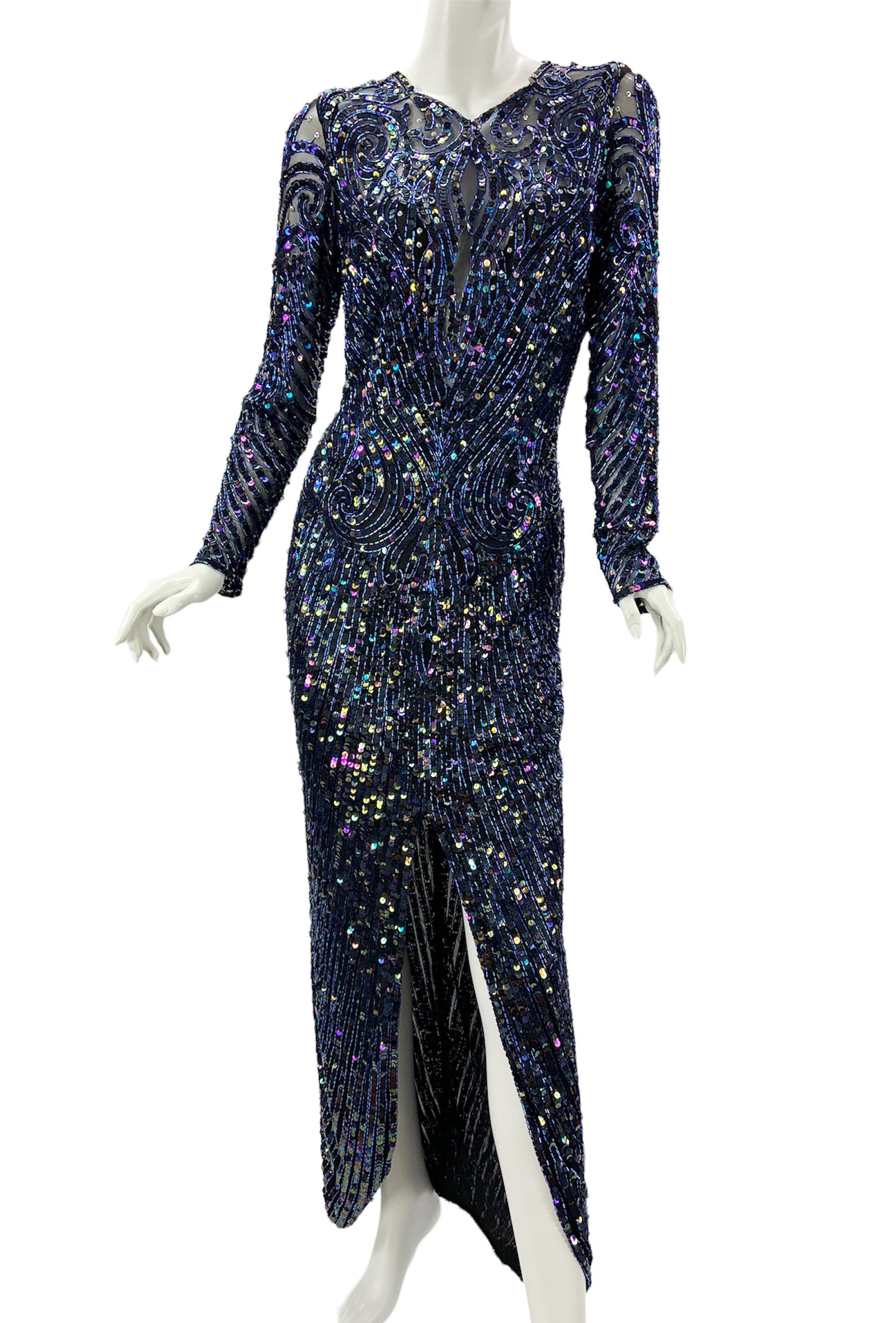 Vintage Bob Mackie Fully Embellished Long Dress Gown
Designer size 10 ( pls. check measurements).
Hand Beaded, 100% Silk, Navy Blue Beads and Multicolor Sequins Over the Black Tulle. 
Fully Lined in Semi Sheer Fabric, Back Zip Closure, Zipper Close