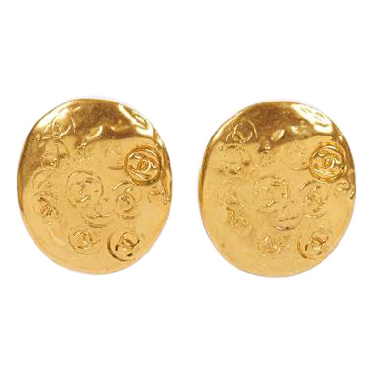 Vintage 80's Chanel Oval Embossed Gold Earrings For Sale