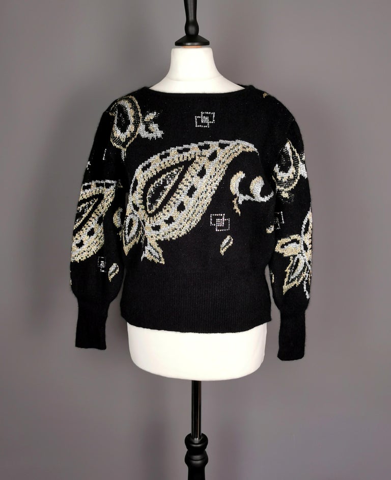 A vintage 1980s funky metallic knit wool sweater or jumper.

This is the epitome of the 1980s and original 80s knitwear is in popular demand, this Mondi design is extremely well made and super wearable today.

Made from wool it has a vibrant
