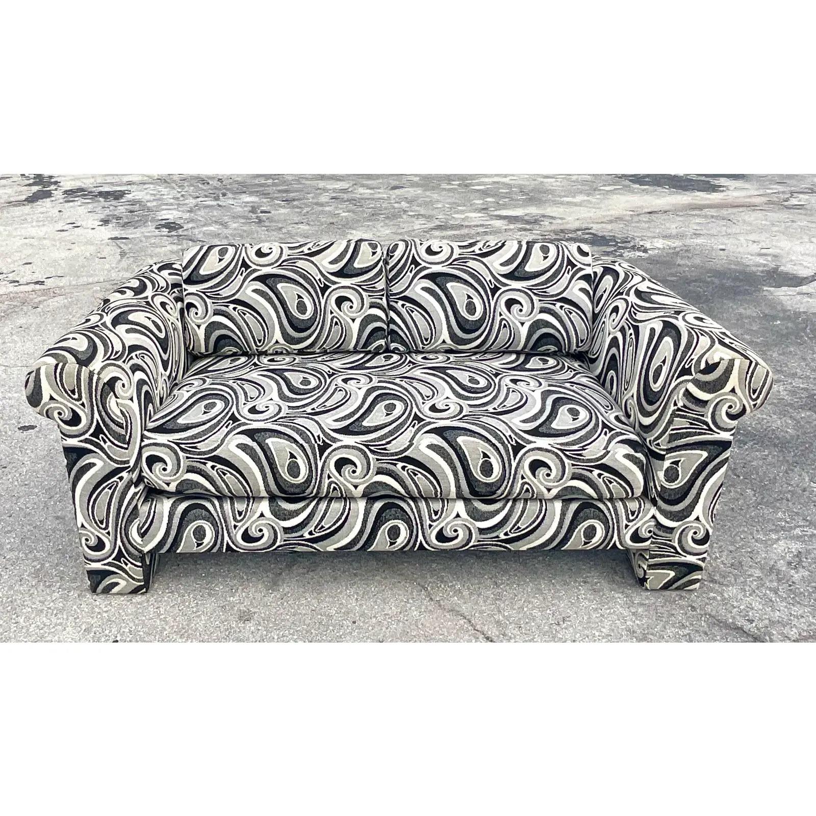 Fantastic vintage 80s Mod jacquard loveseat. Beautiful graphic print fabric on a chic high sides design. Made by the iconic Dreyfuss group, the maker of the iconic Kagan sofas. Two loveseats available if you prefer a set. Acquired from a Palm Beach