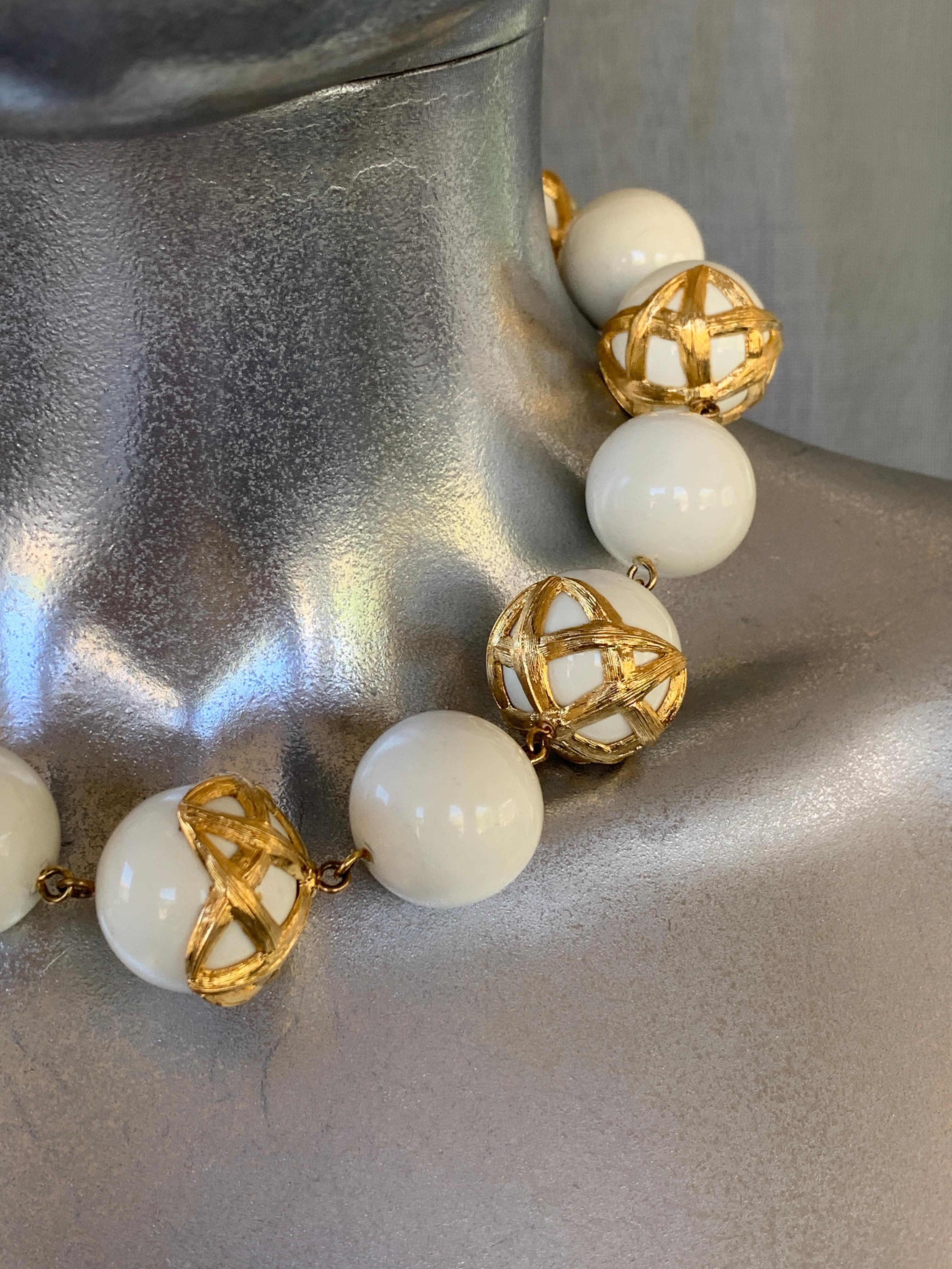 This necklace is as timeless and glamorous as when it was designed. Monet did some really beautiful jewelry in the 70s and 80s. This upscale piece is one of the best we have seen. White spheres (look like ceramic balls) have this peautiful detail.